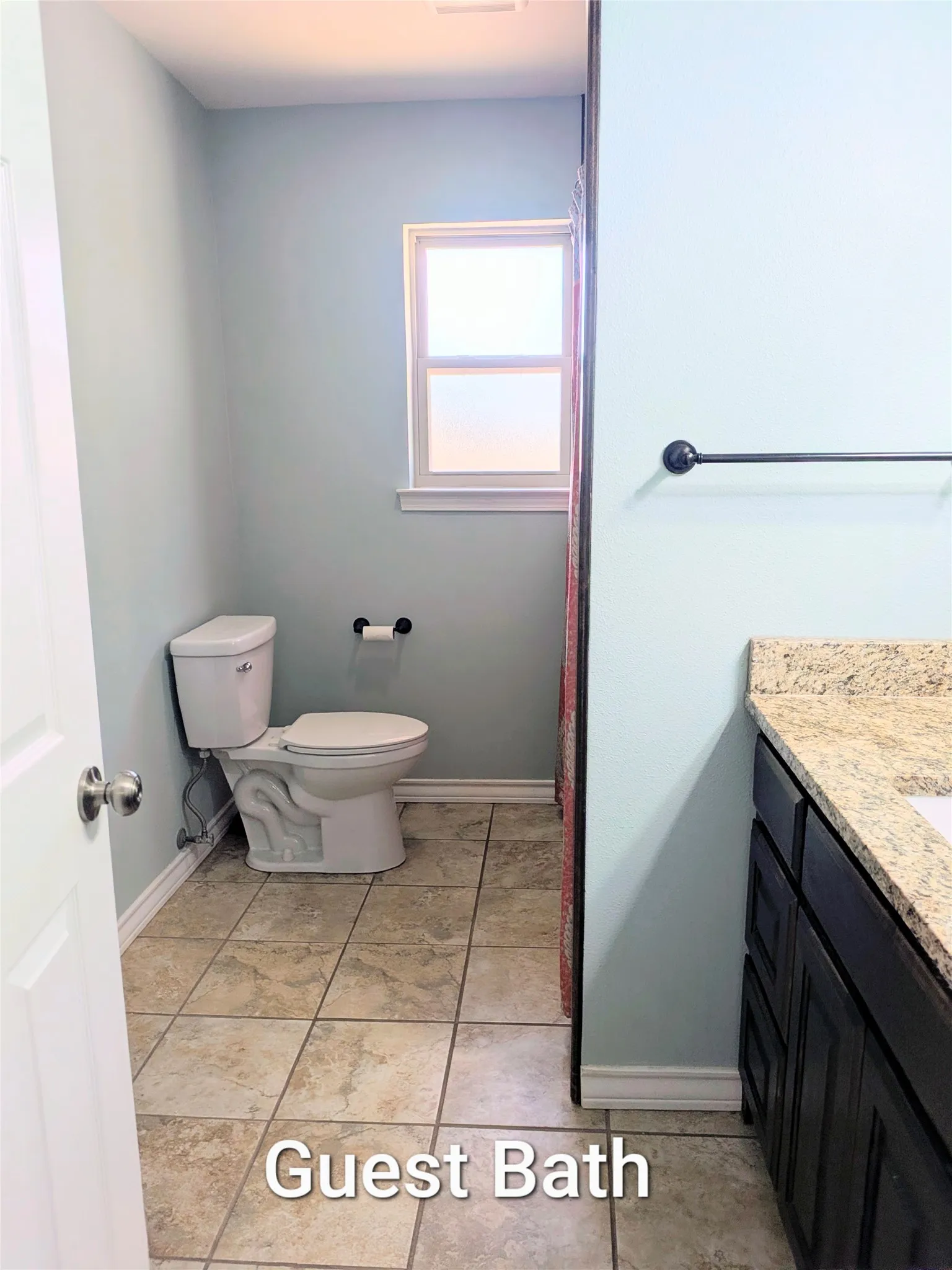 Guest bath looking in from doorway - sits at the end of the hallway