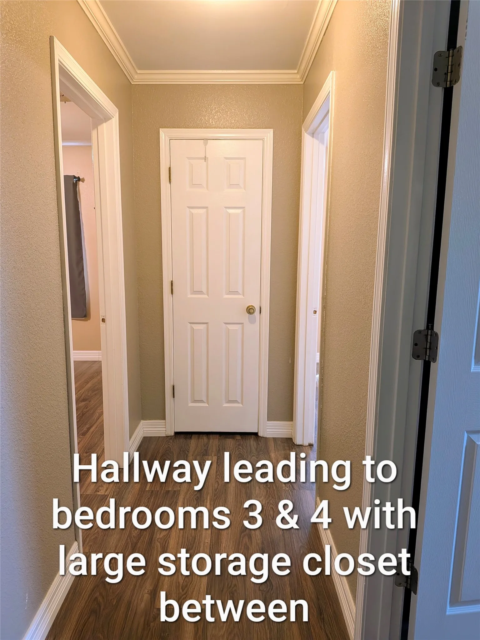 Short hallway if you turn left at the bathroom. This takes you to the other 2 bedrooms.