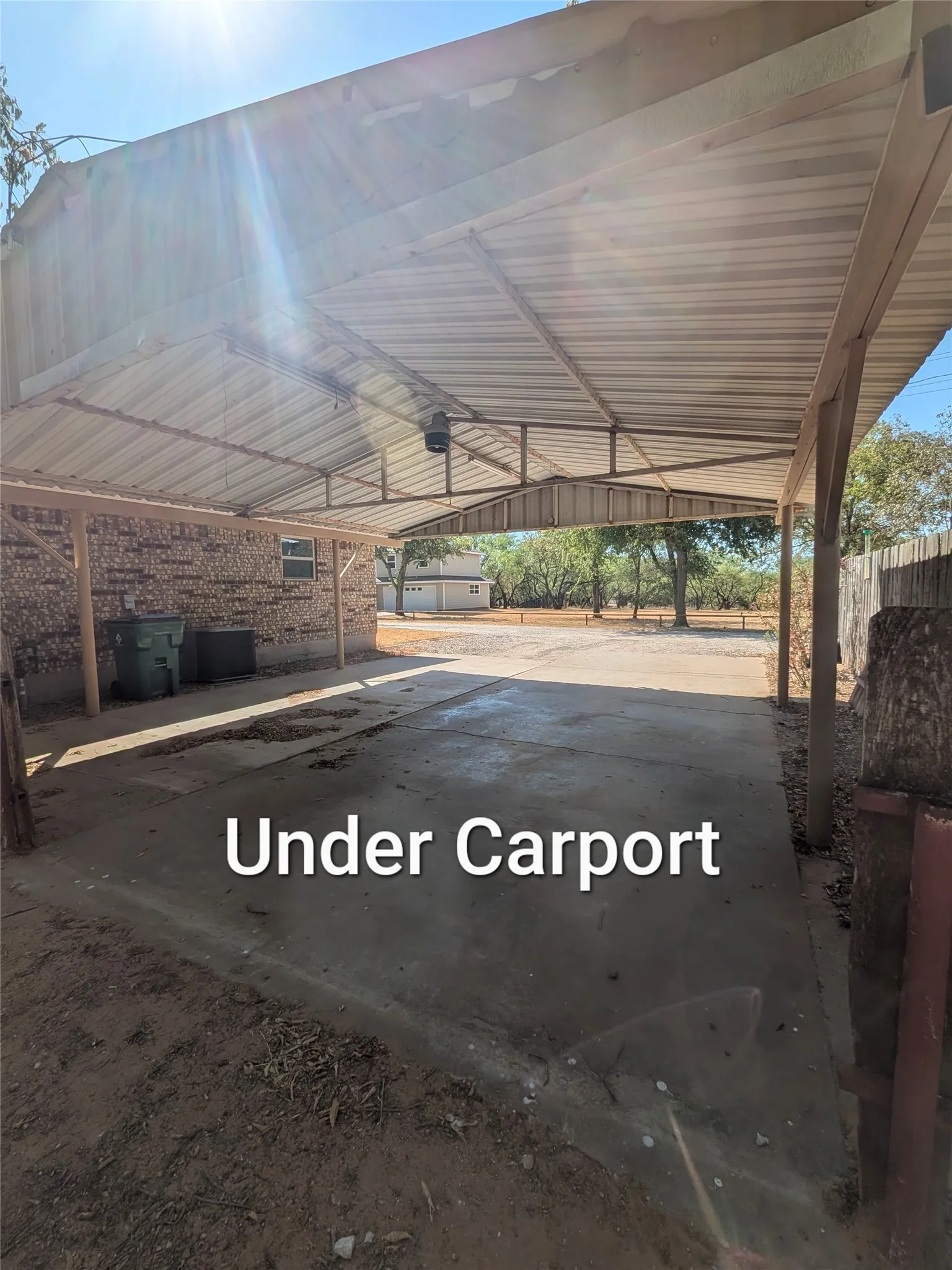 Large carport that leads to deck