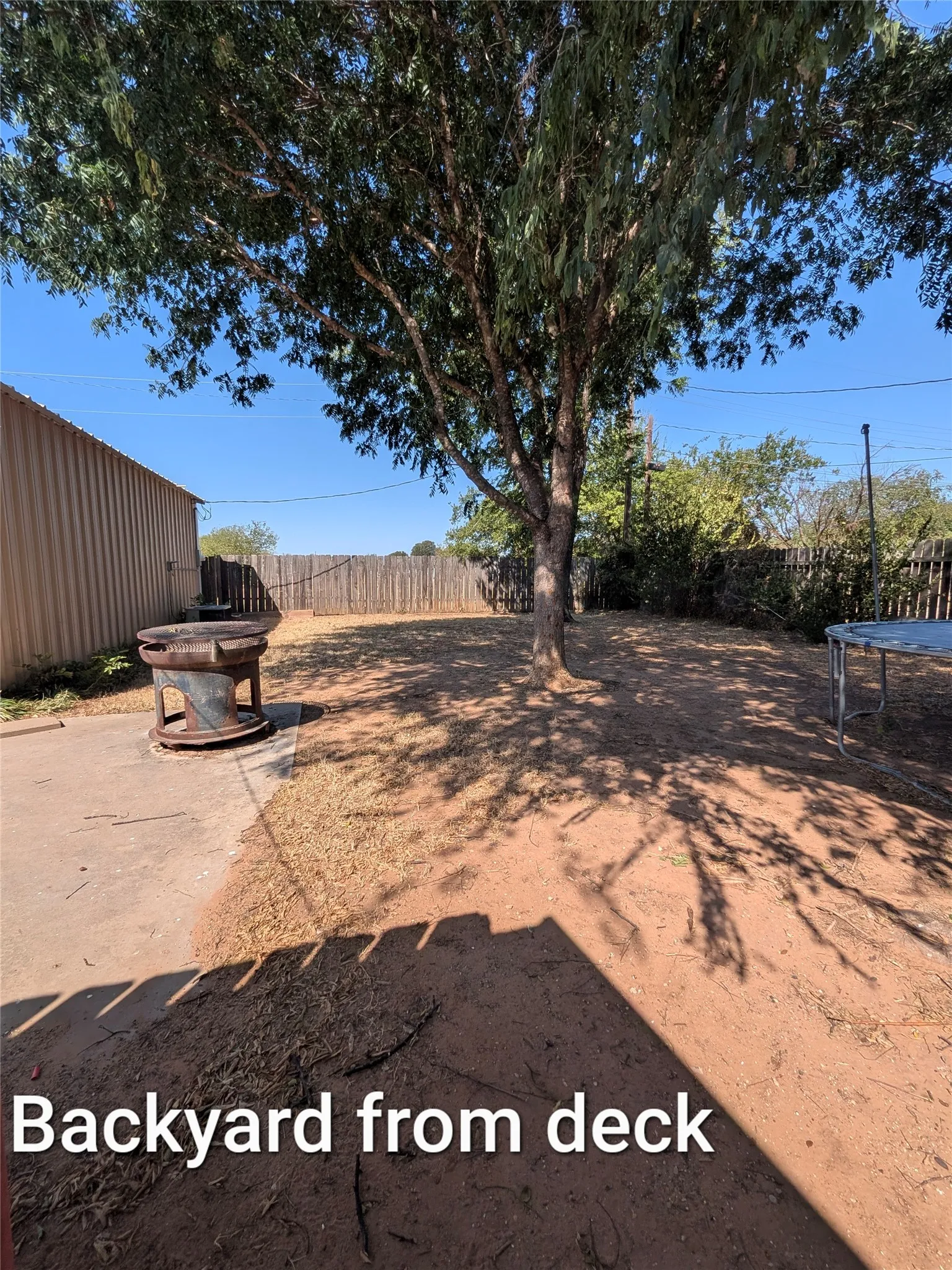Large backyard with beautiful shade trees - take from deck