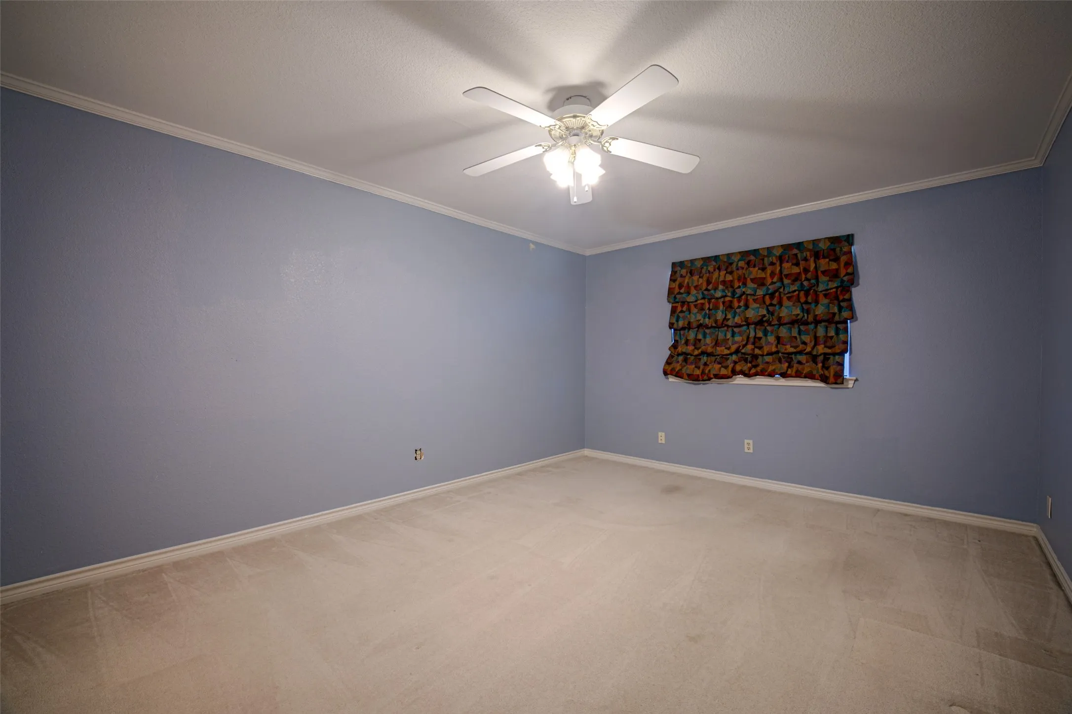 Recessed lighting, crown molding, and a ceiling fan with light fixture