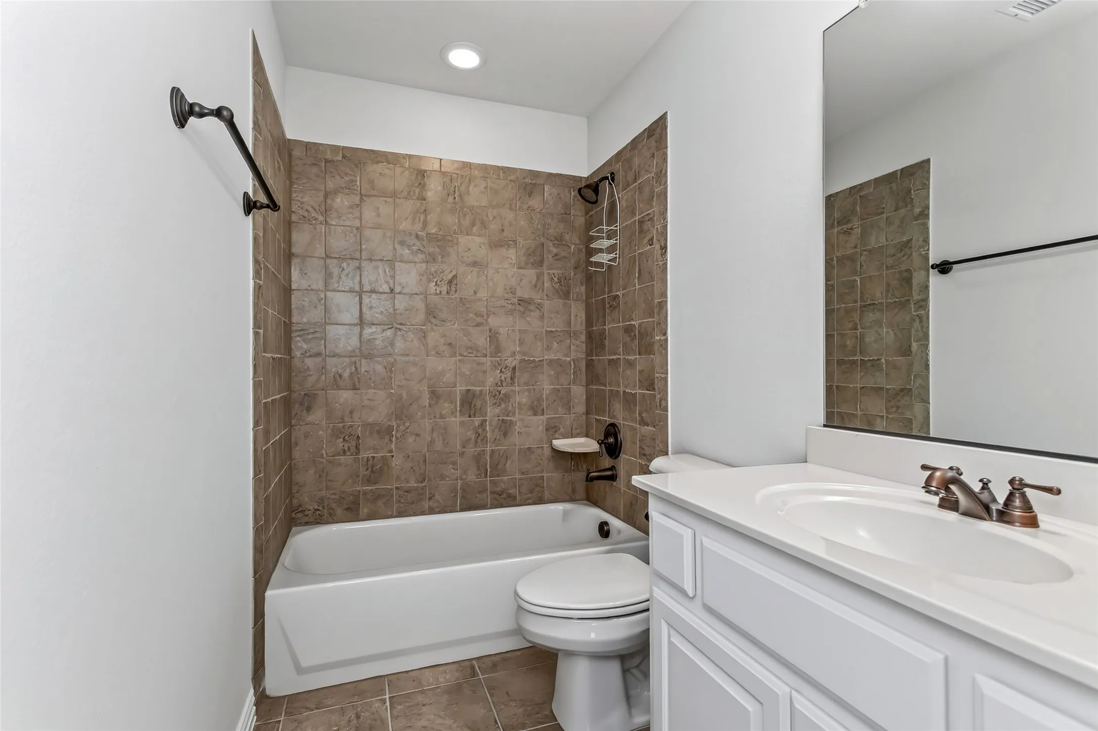 2nd floor bathroom. White vanity with a single basin sink, bronze-finish faucet, and an overhead mirror