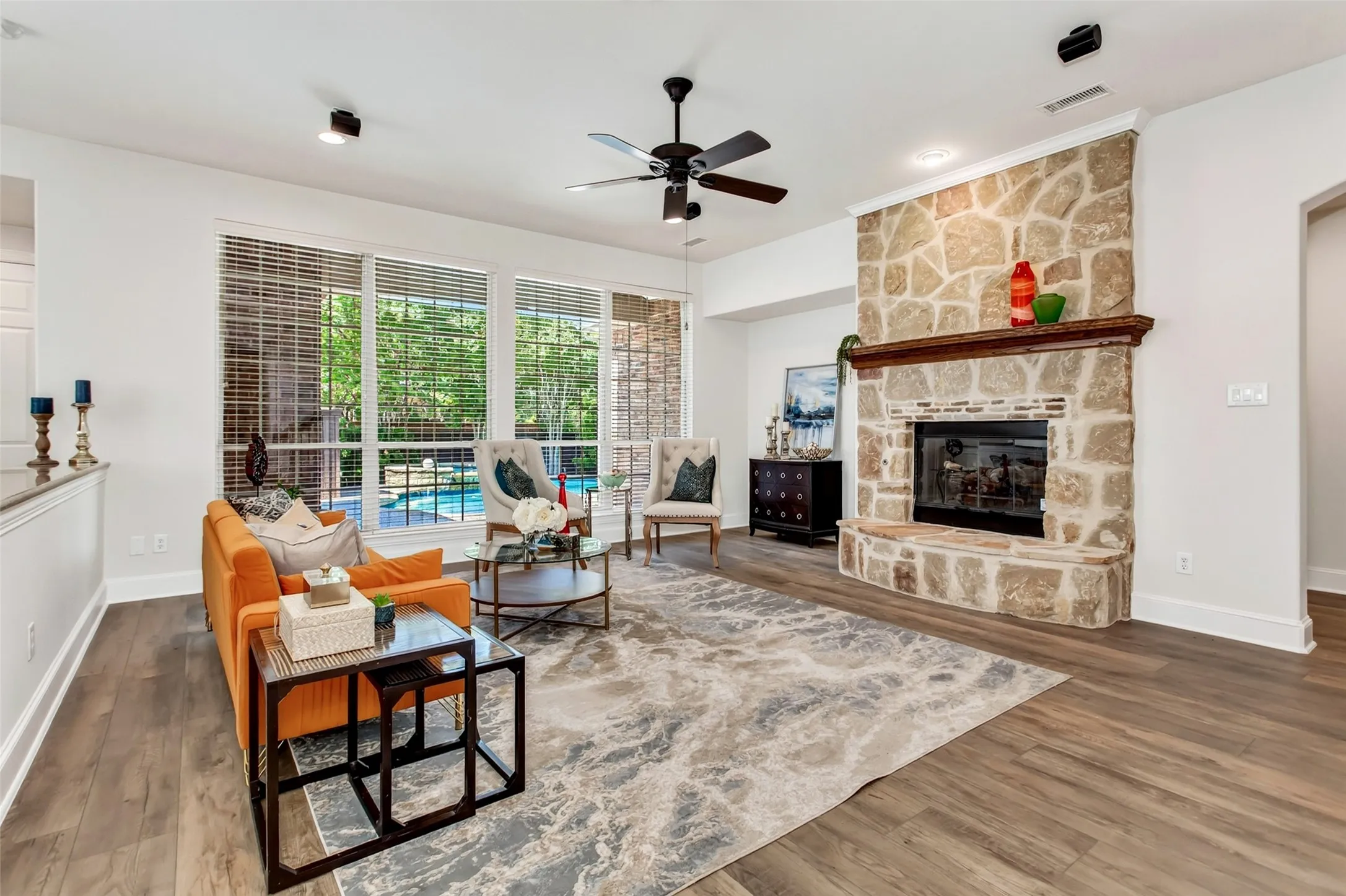 Stone-clad fireplace with a wood mantel