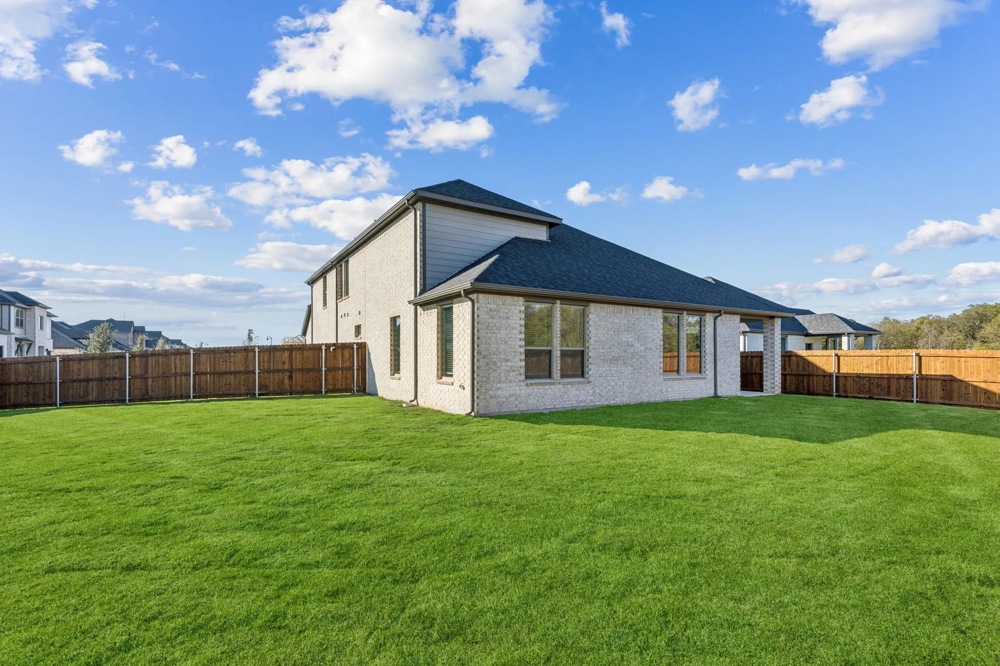 Covered Patio in the Wimbledon home plan by Trophy Signature Homes – REPRESENTATIVE PHOTO
