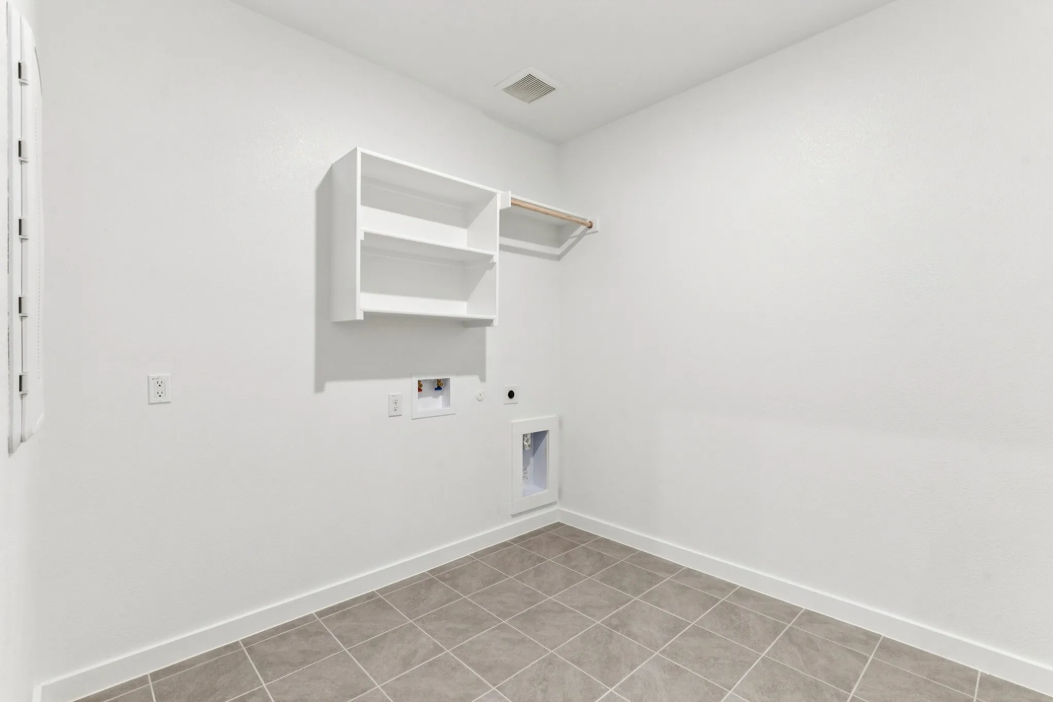 Utility Room in the Wimbledon home plan by Trophy Signature Homes – REPRESENTATIVE PHOTO