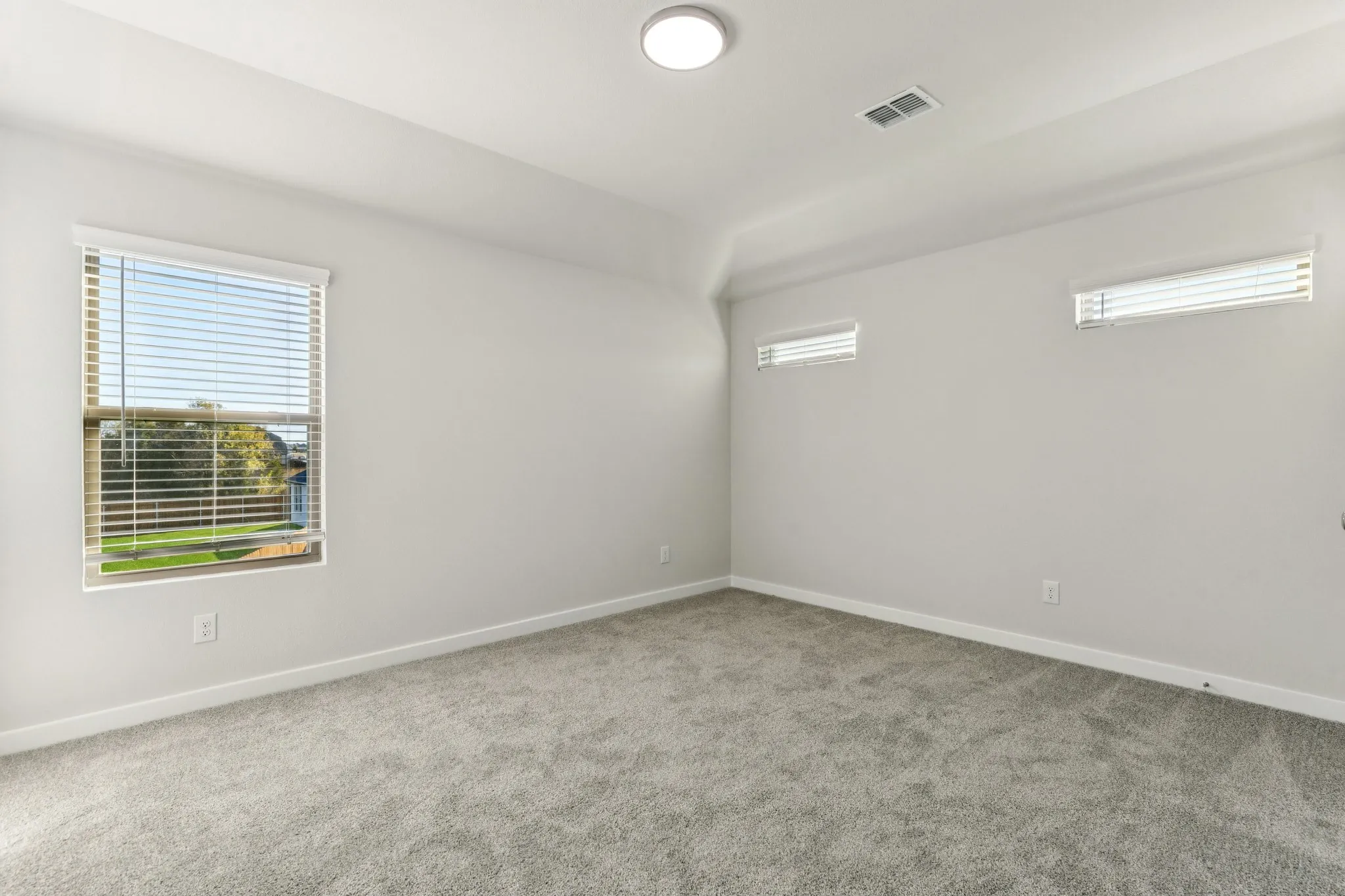 Bedroom in the Wimbledon home plan by Trophy Signature Homes – REPRESENTATIVE PHOTO