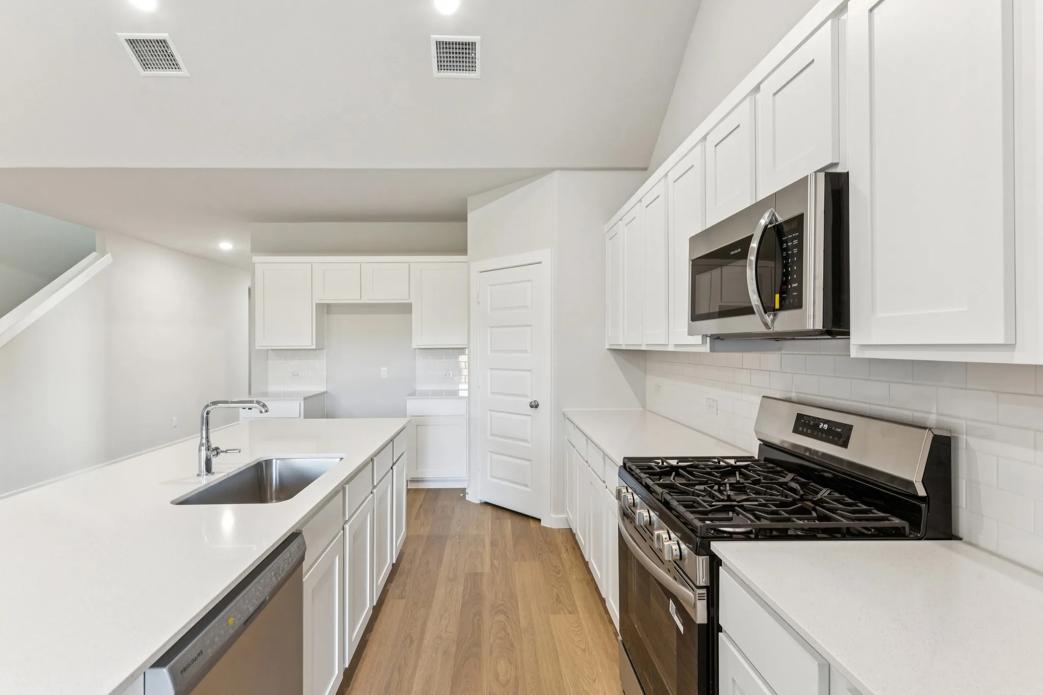 Kitchen in the Wimbledon home plan by Trophy Signature Homes – REPRESENTATIVE PHOTO