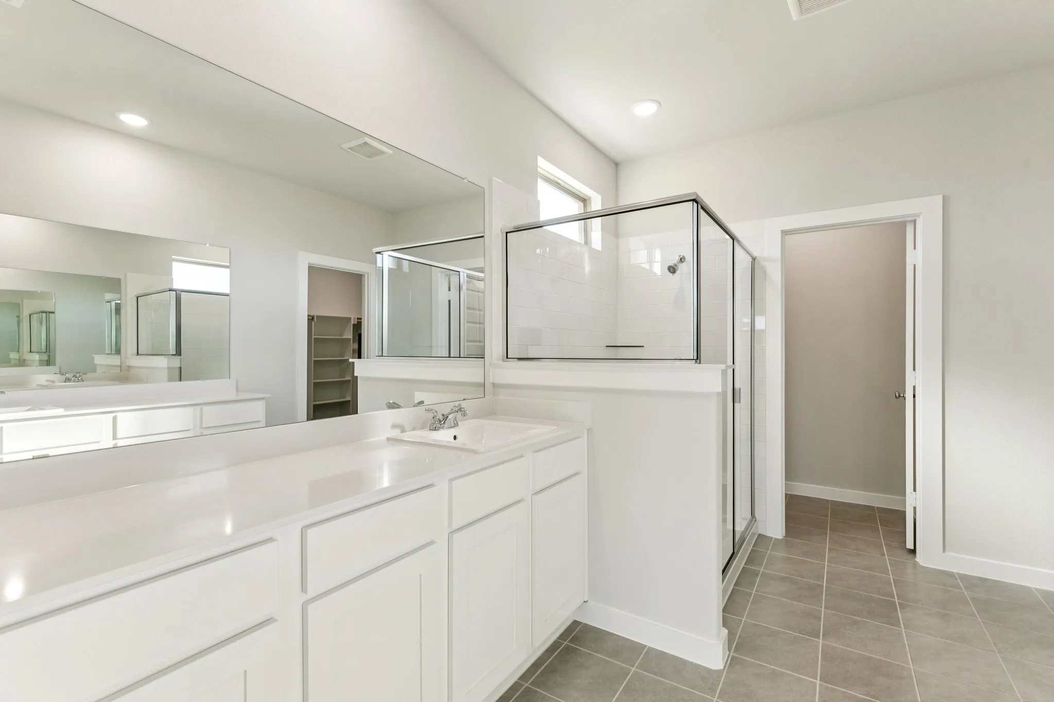 Primary Bathroom in the Wimbledon home plan by Trophy Signature Homes – REPRESENTATIVE PHOTO