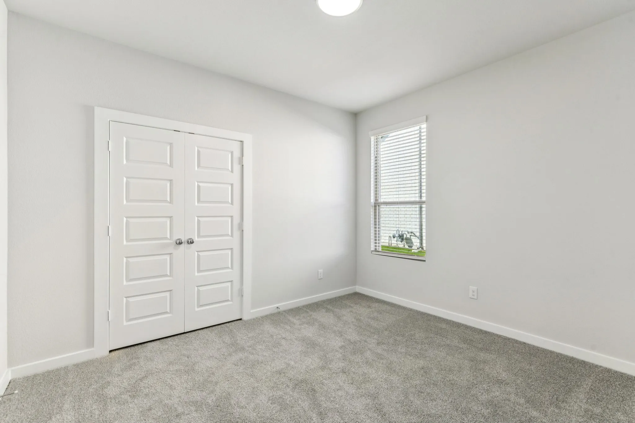 Bedroom in the Wimbledon home plan by Trophy Signature Homes – REPRESENTATIVE PHOTO