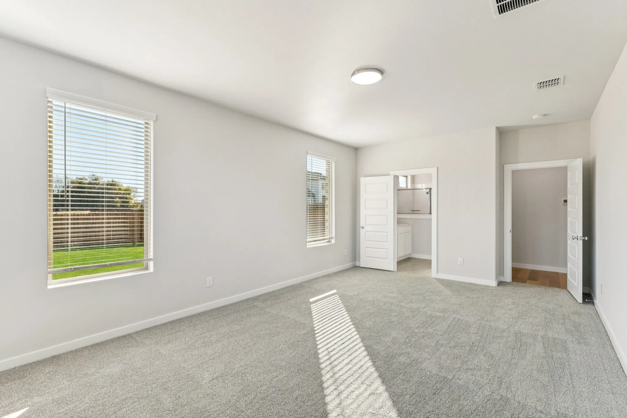 Primary Suite in the Wimbledon home plan by Trophy Signature Homes – REPRESENTATIVE PHOTO