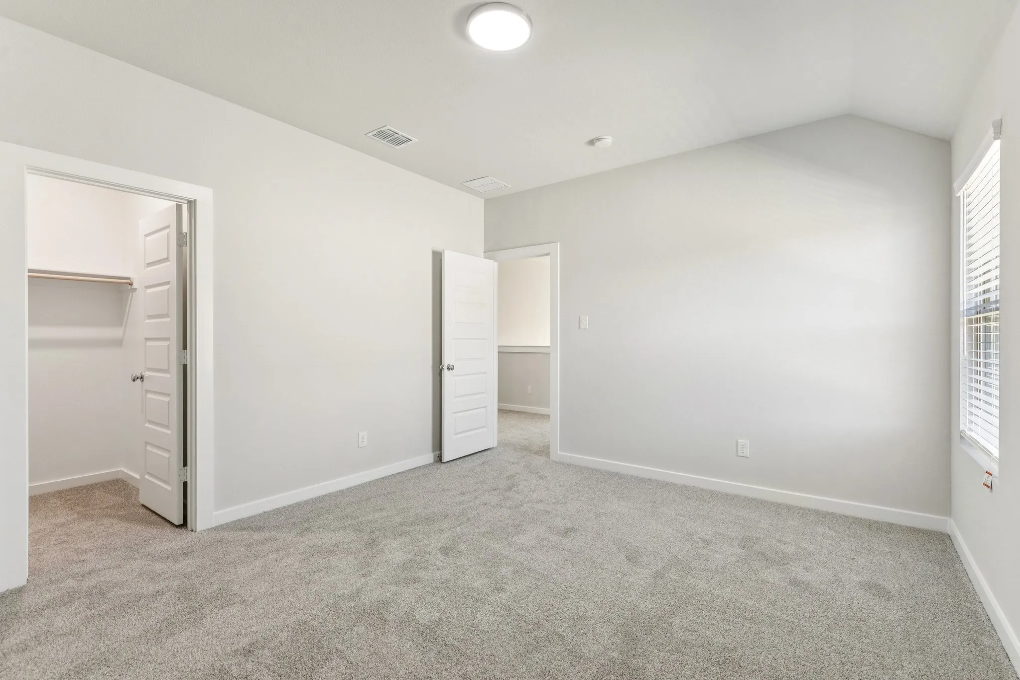 Bedroom in the Wimbledon home plan by Trophy Signature Homes – REPRESENTATIVE PHOTO