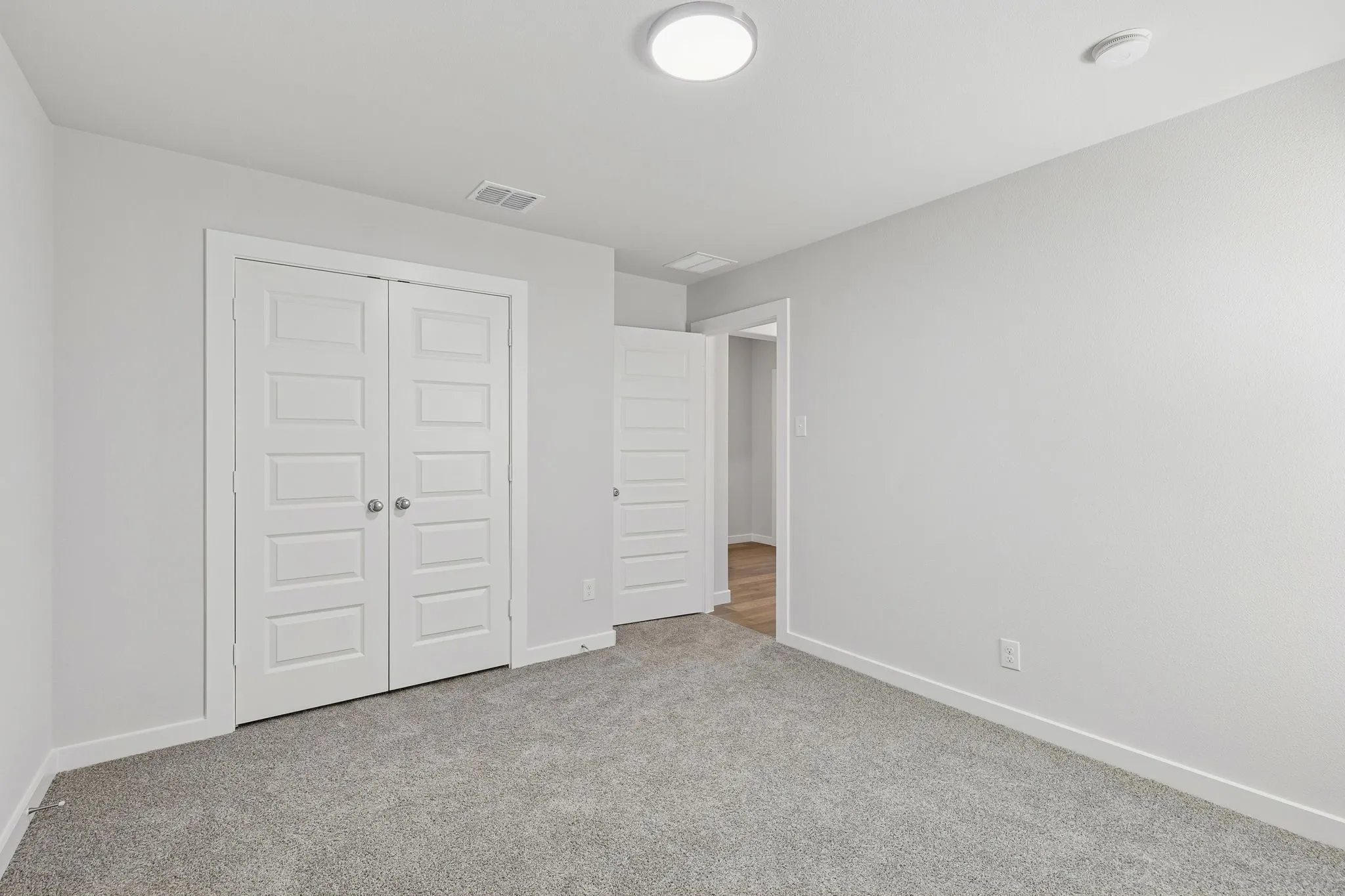 Bedroom in the Harrison home plan by Trophy Signature Homes – REPRESENTATIVE PHOTO