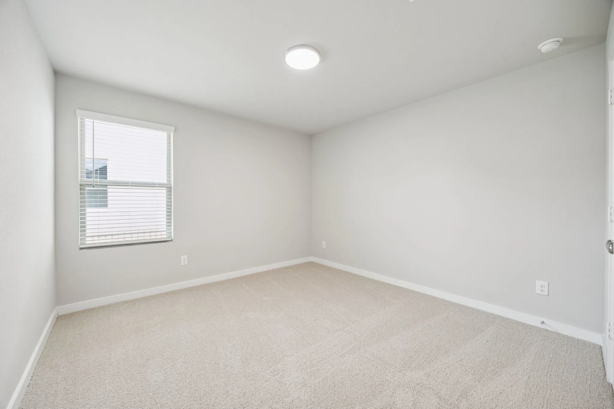 Bedroom in the Hayden home plan by Trophy Signature Homes – REPRESENTATIVE PHOTO