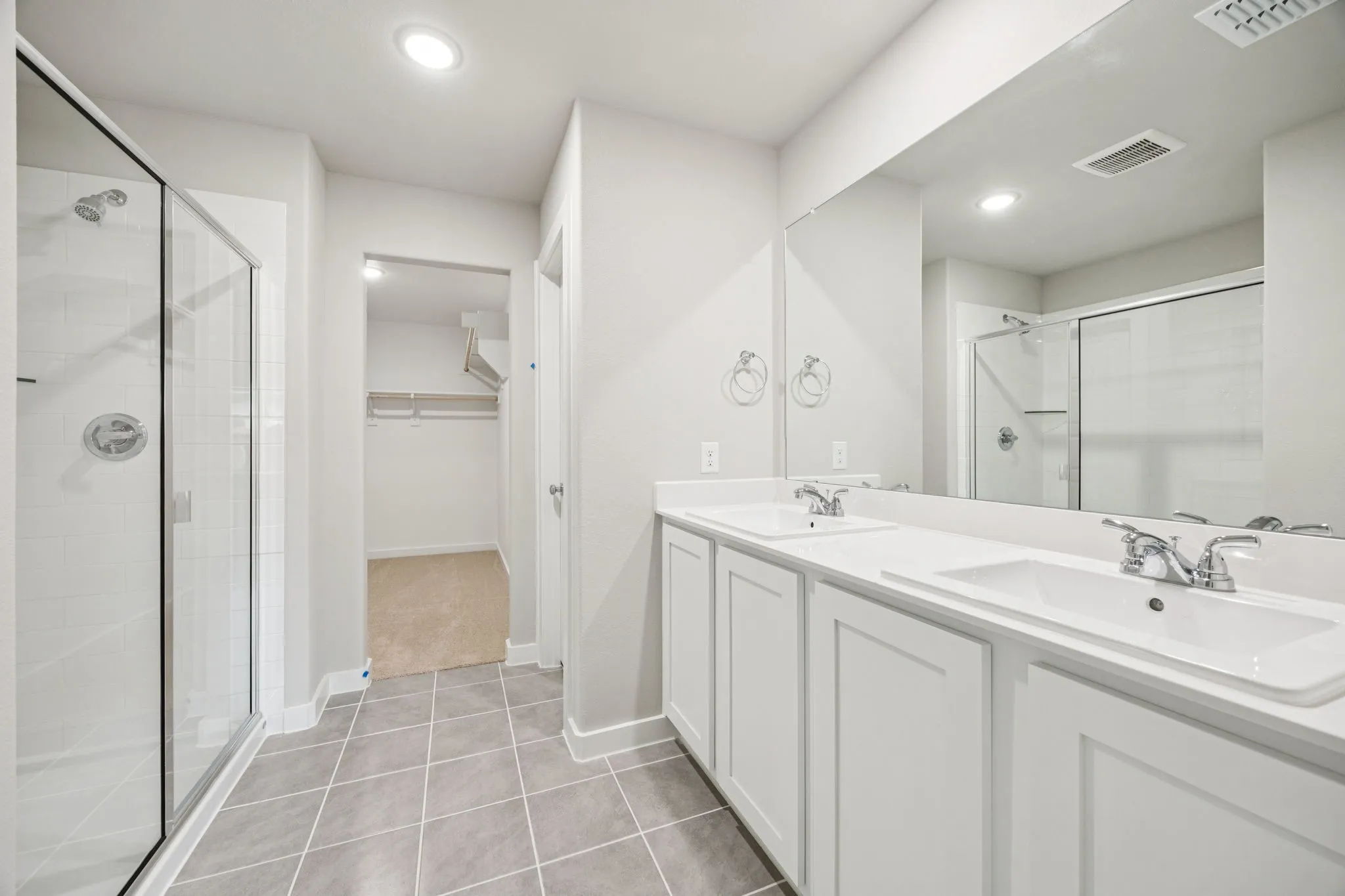 Primary Bathroom in the Hayden home plan by Trophy Signature Homes – REPRESENTATIVE PHOTO