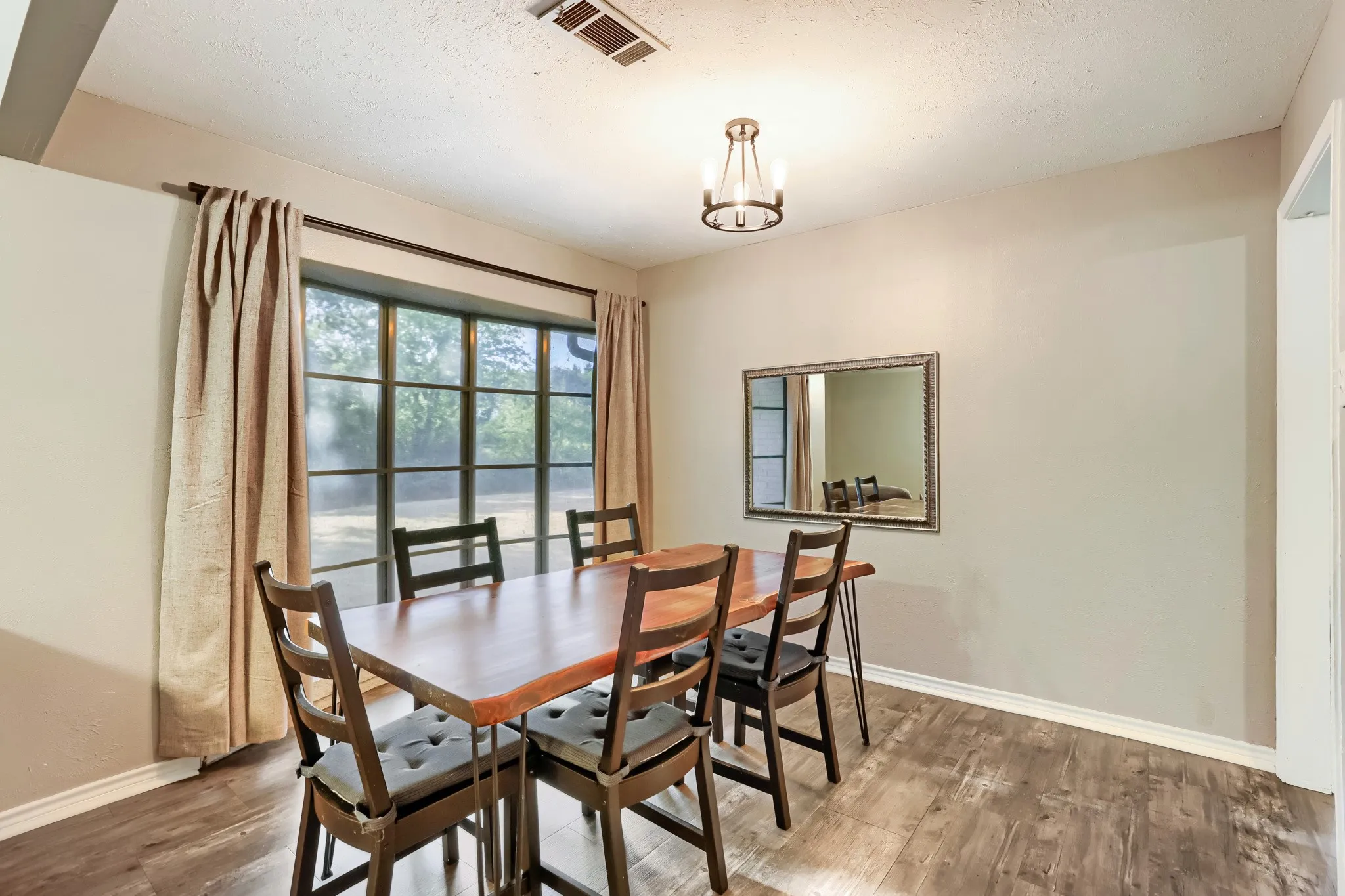 Wood-finish flooring throughout, paired with light-toned wall paint