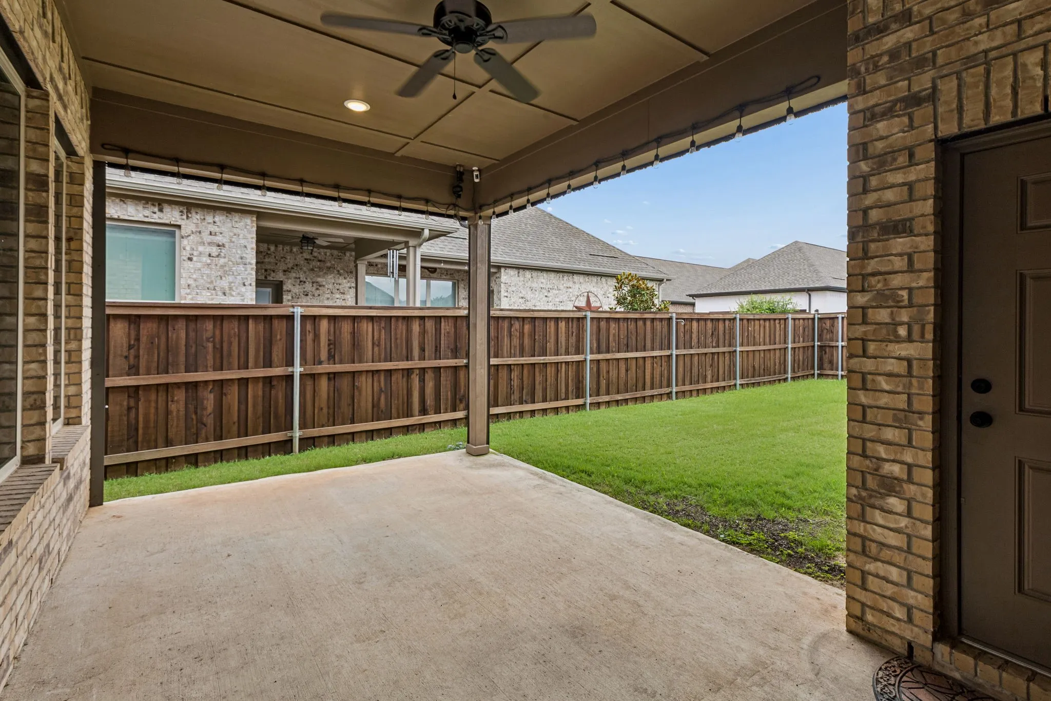 Covered patio with concrete flooring, recessed lighting, and a ceiling fan