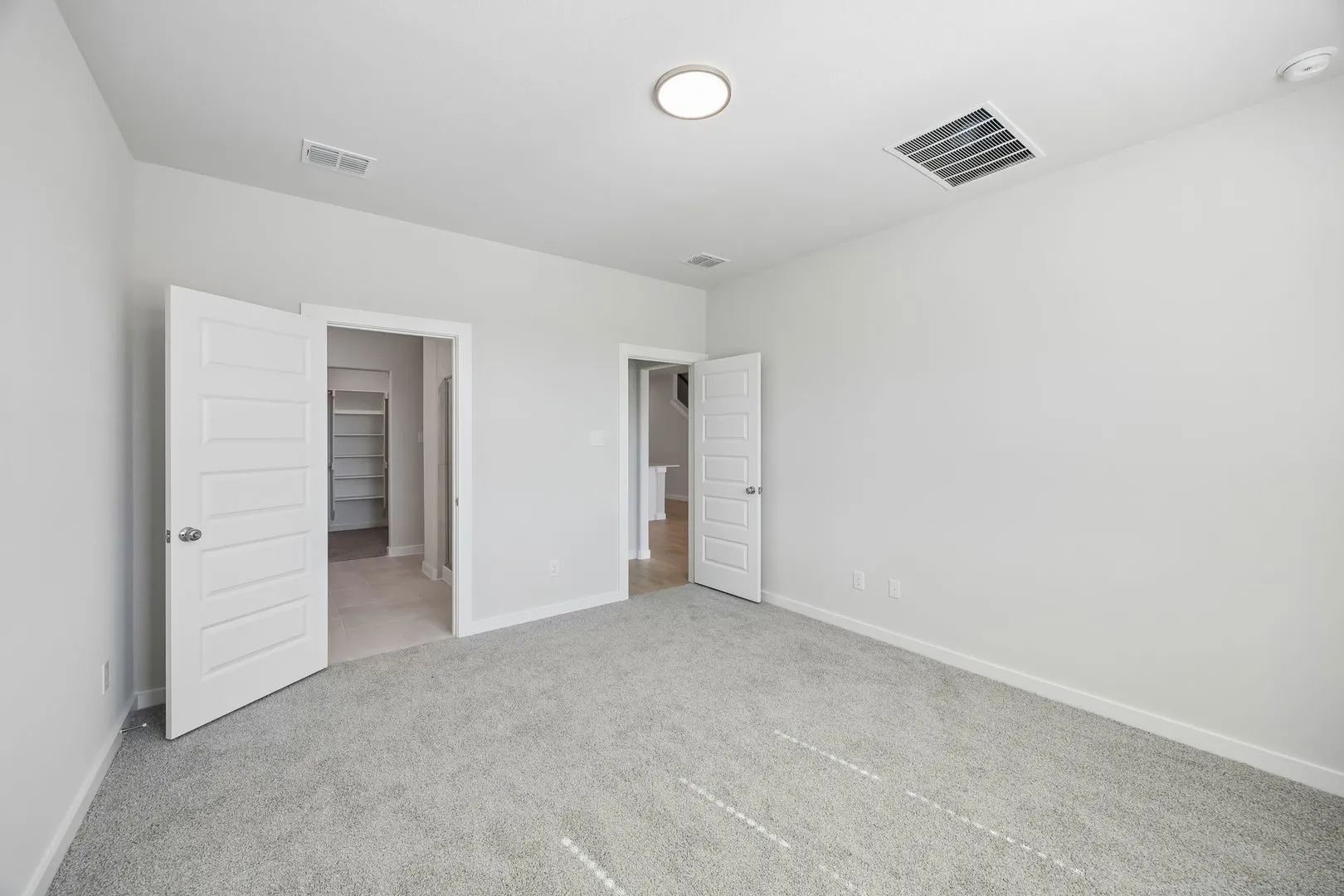 Primary Suite in the Mesquite home plan by Trophy Signature Homes – REPRESENTATIVE PHOTO