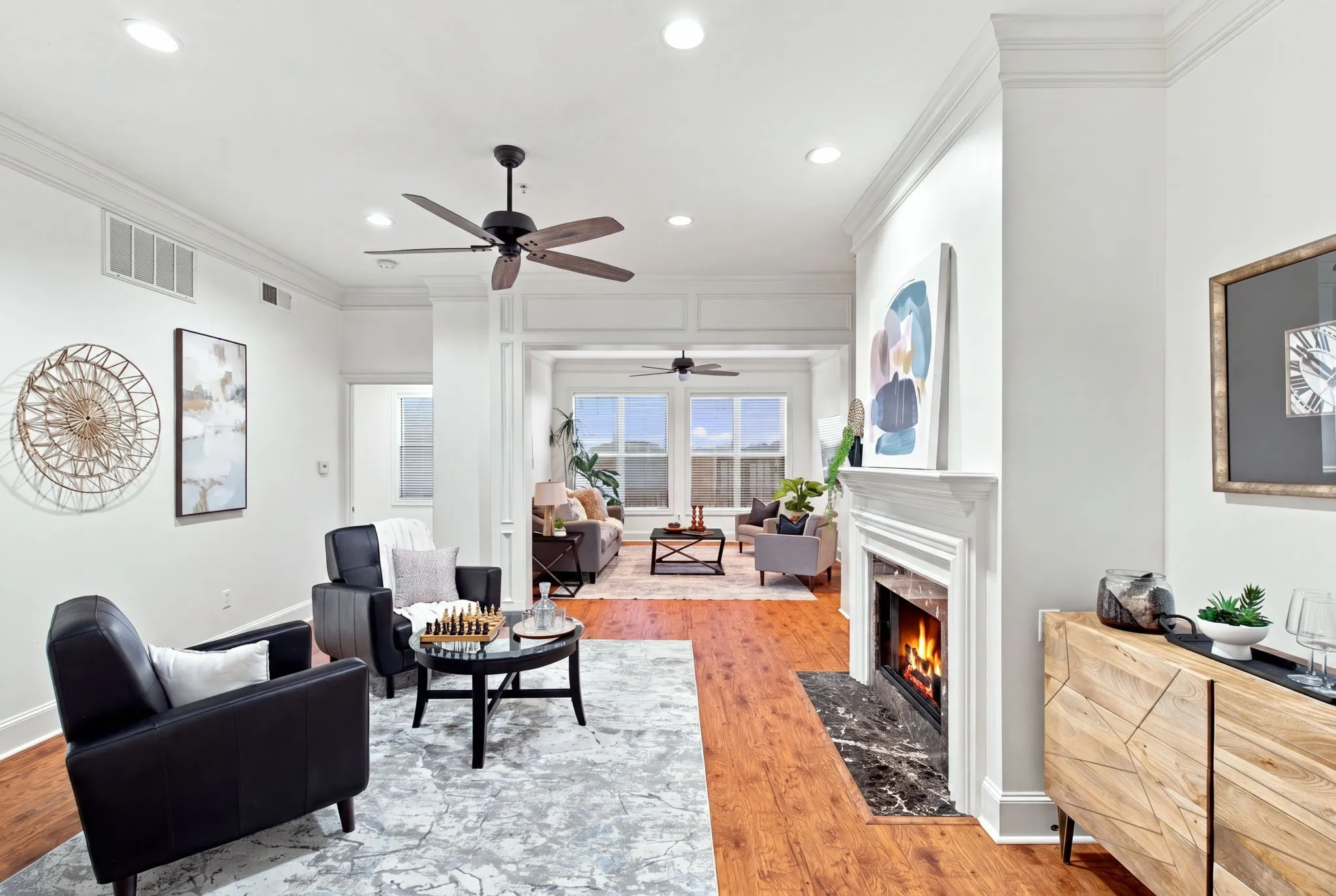 Den with fireplace and living room.
