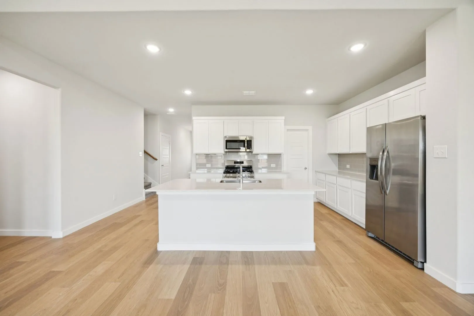 Kitchen in the Masters home plan by Trophy Signature Homes – REPRESENTATIVE PHOTO