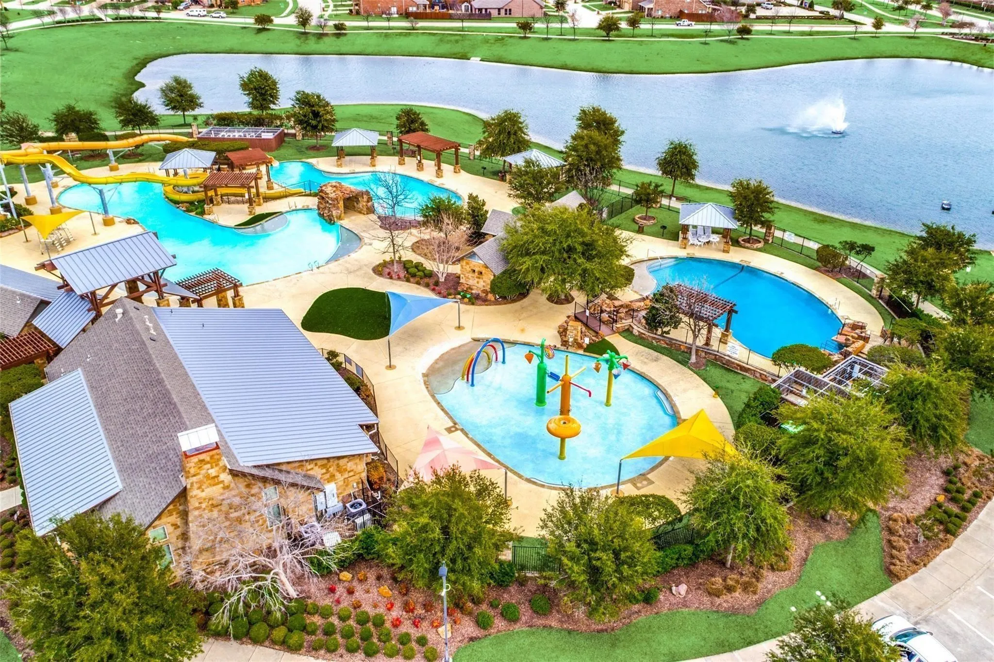 View of pool featuring a water view, a patio, and a water slide