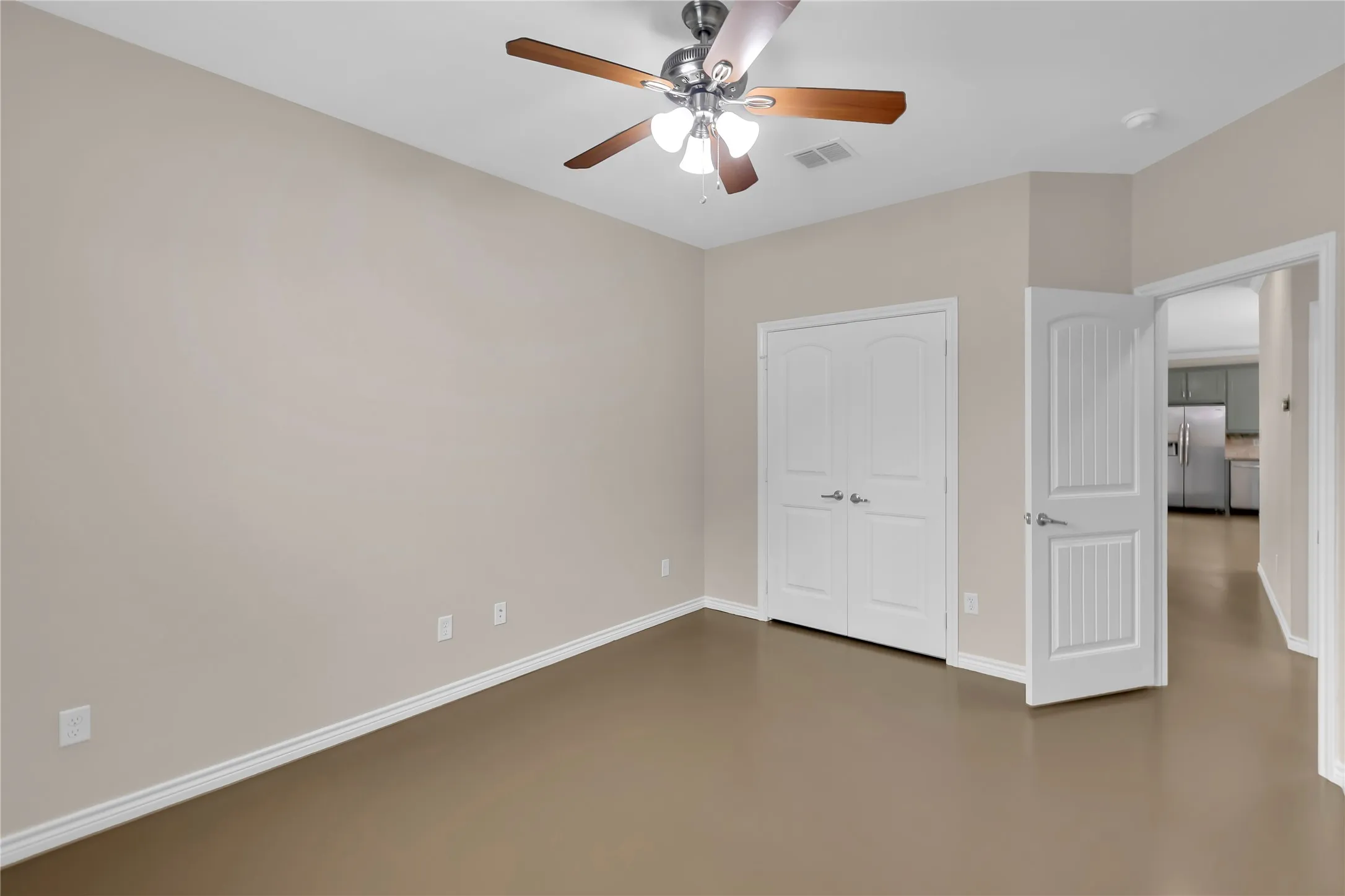 Recessed lighting, wood-finish ceiling fan, neutral wall tones, white trim, and a double-door closet