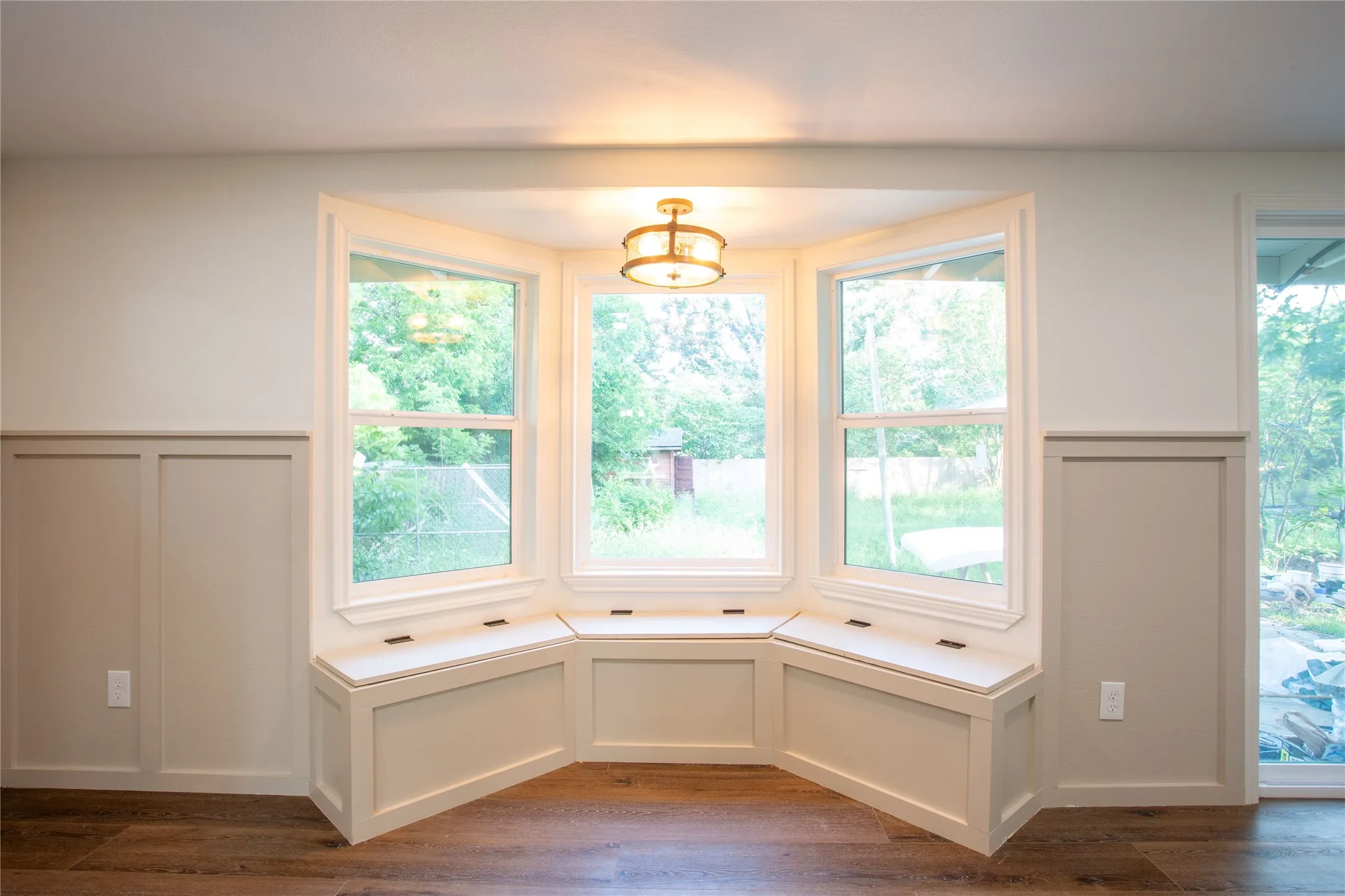 Bay window featuring integrated storage benches