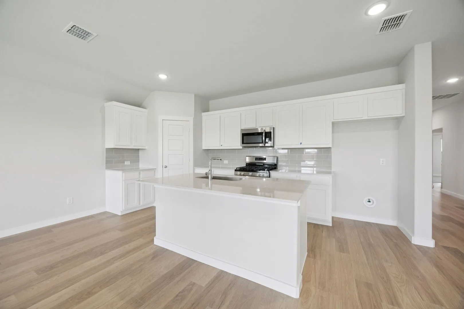 Kitchen in the Hadley home plan by Trophy Signature Homes – REPRESENTATIVE PHOTO