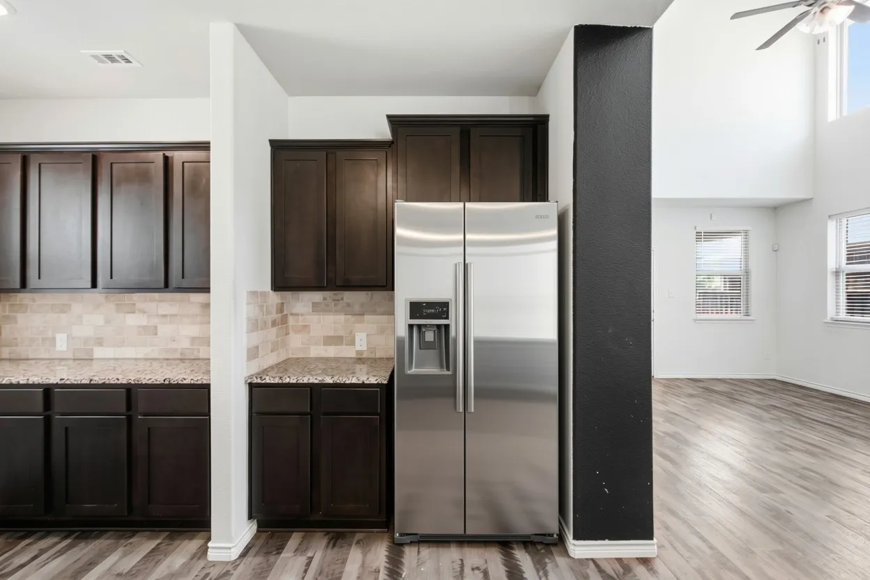 Separate beverage area with additonal counter and cabinet space, perfect for a coffee bar. Plus brand new refrigerator.