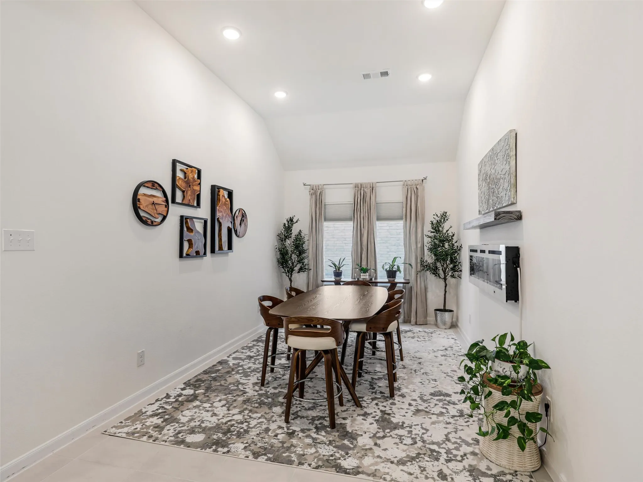 Vaulted ceilings and recessed lighting illuminate the interior