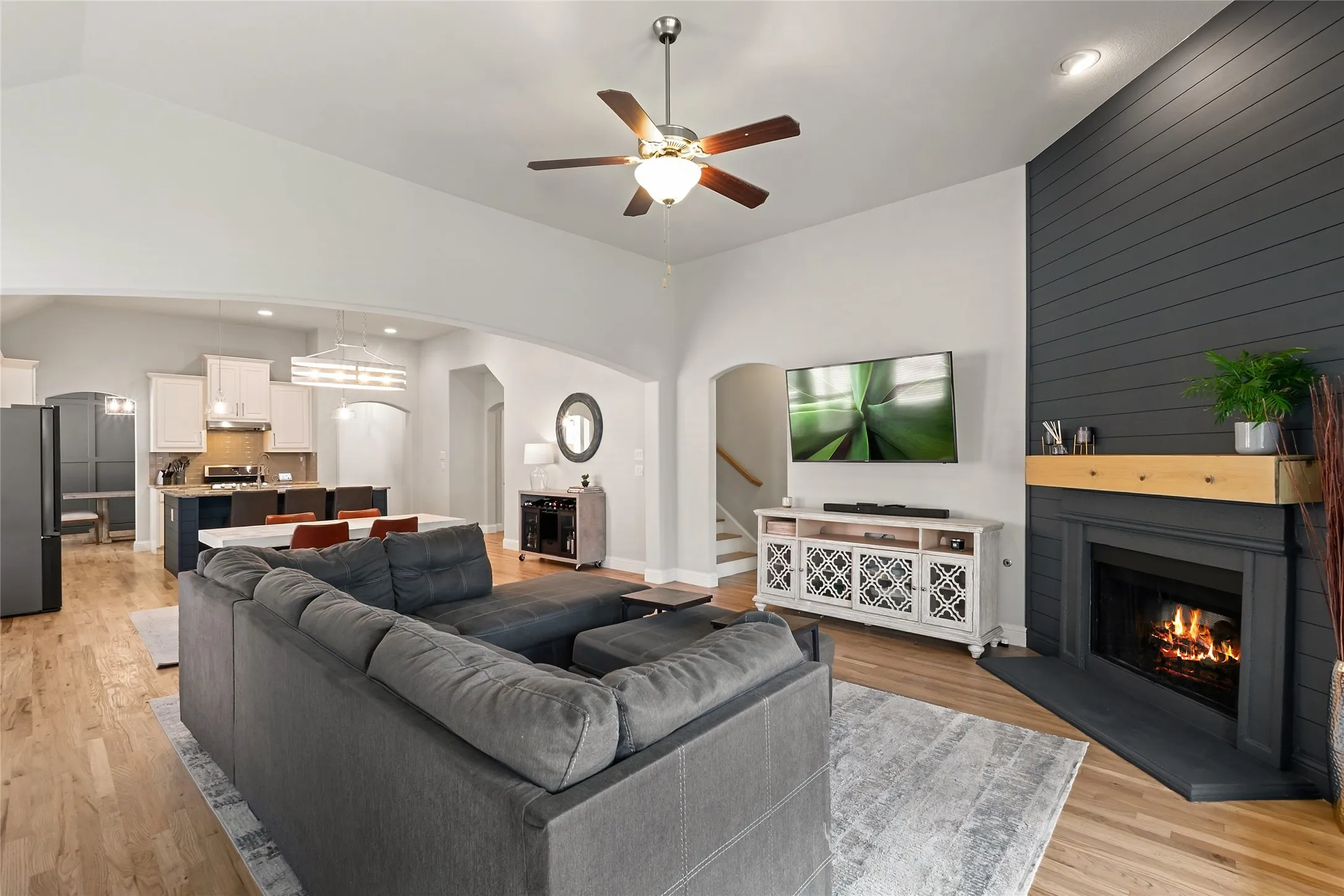Vaulted ceilings, wood-finish flooring, and recessed lighting