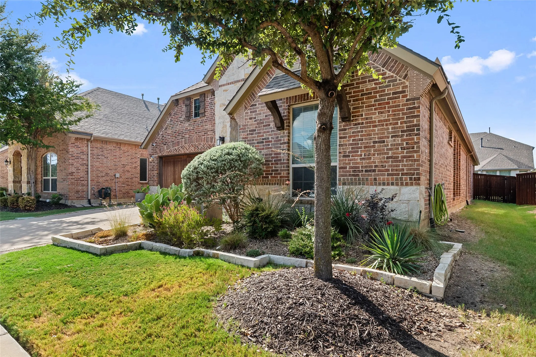 Brick and stone exterior with a gabled roofline