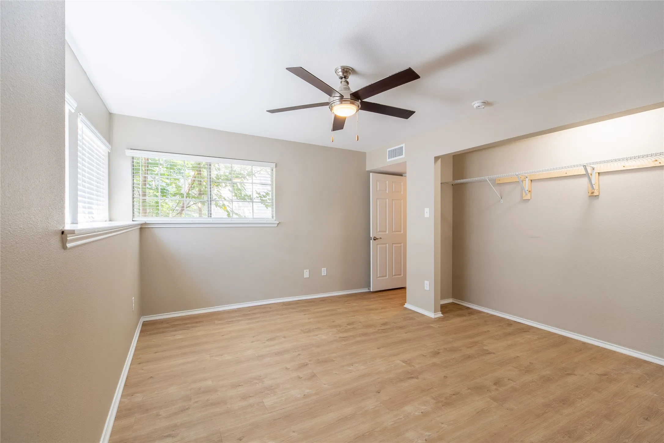 Wood-finish flooring with neutral wall tones