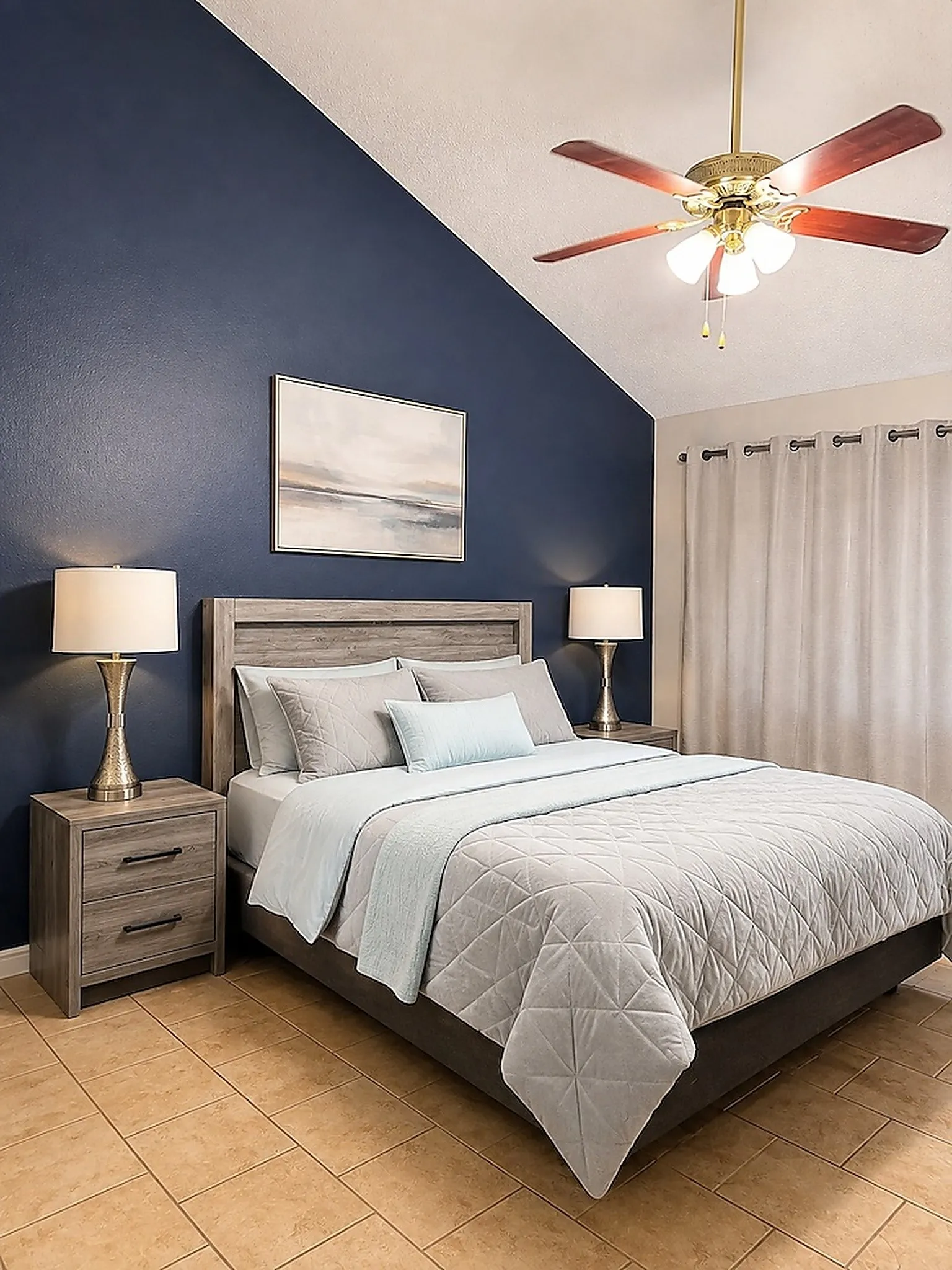 Primary - Vaulted ceiling with an attached ceiling fan, tile flooring, and wood-finish headboard