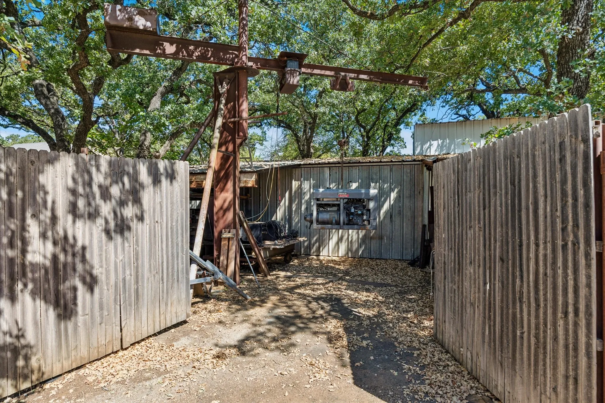 Storage shed 2 at back; crane conveys As Is with structures.