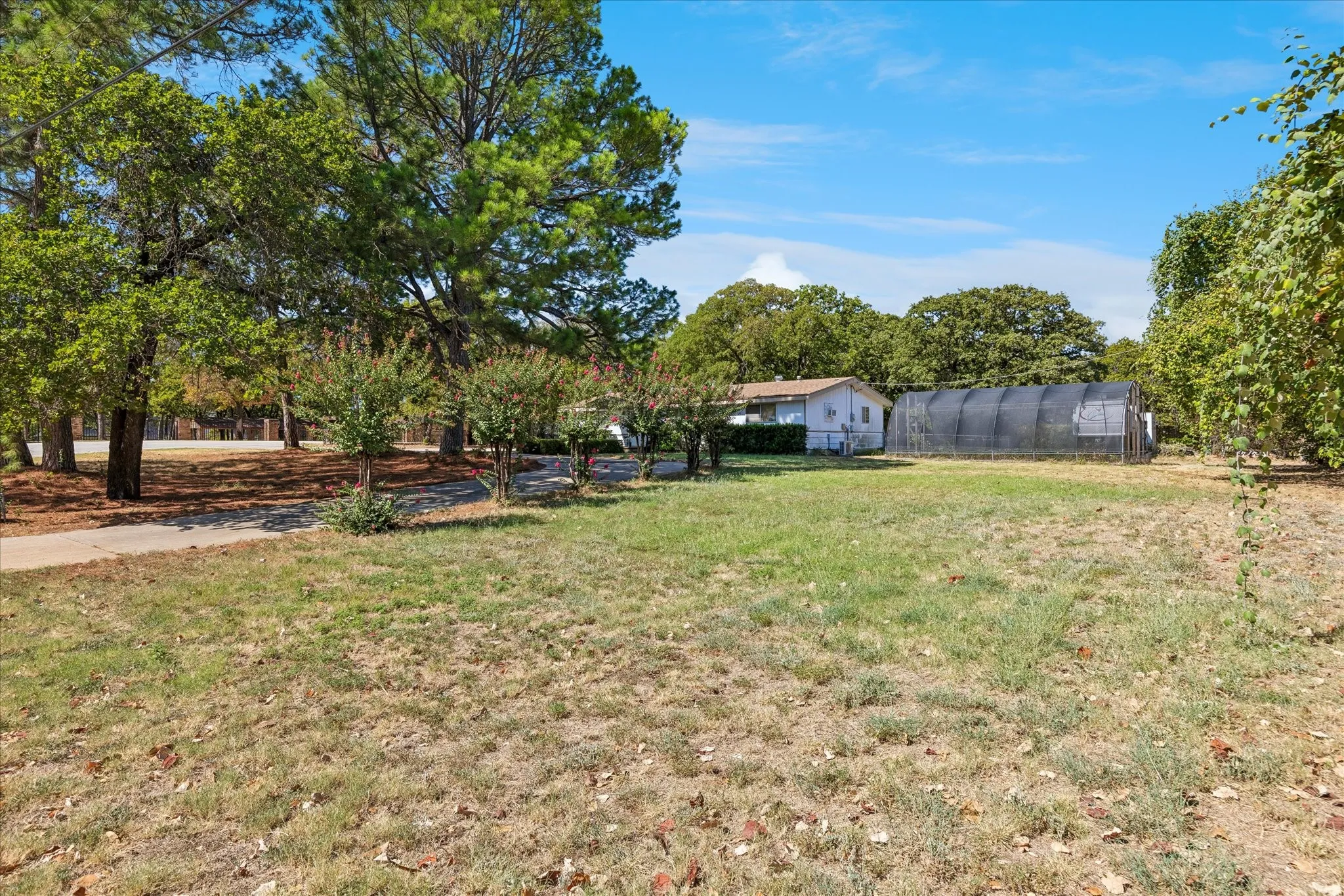 Located on high ground in a forested area of Southlake, the property is 1.15 acres and contains 15 mature Oak trees and five 40-50' Pine trees.