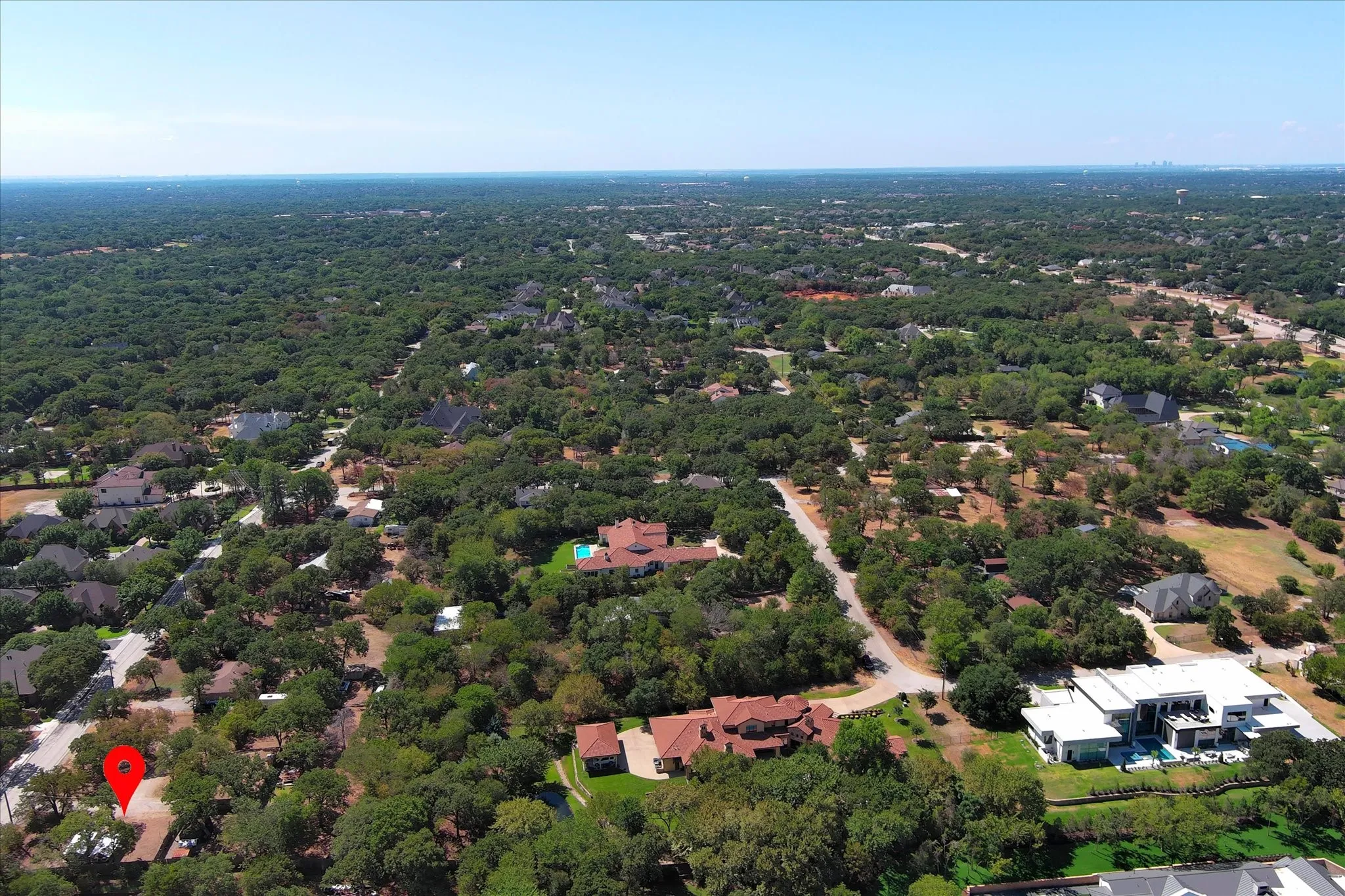 Red marks the property location and shows nearby estate homes the heavily forested general area.