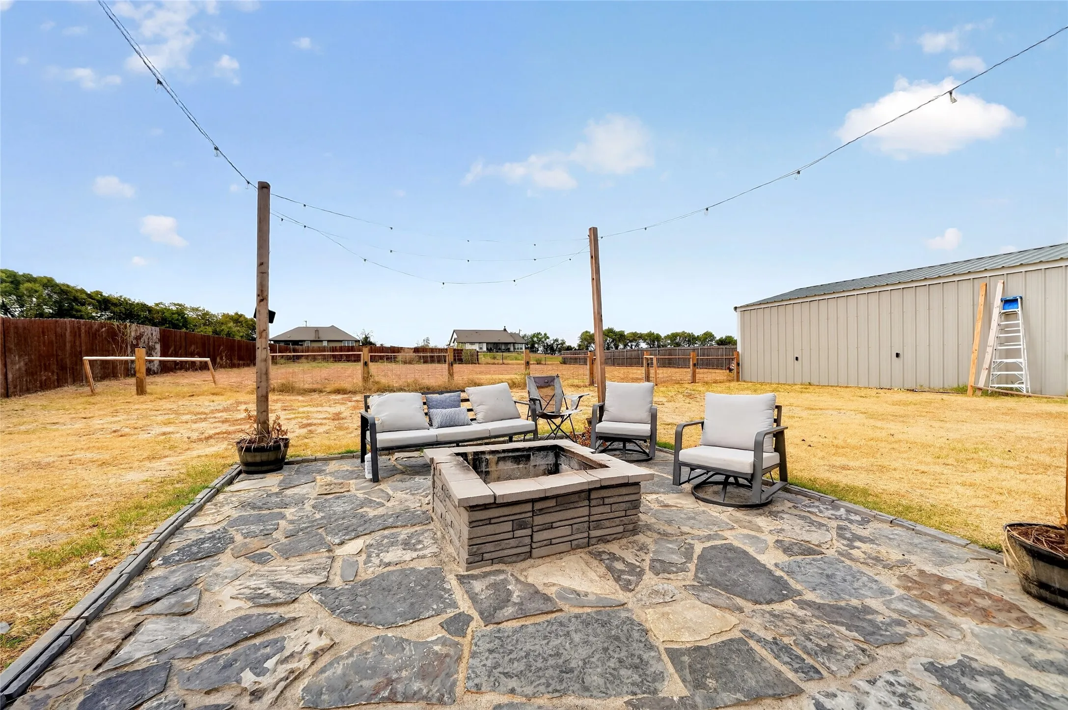 Stone patio with a built-in fire pit