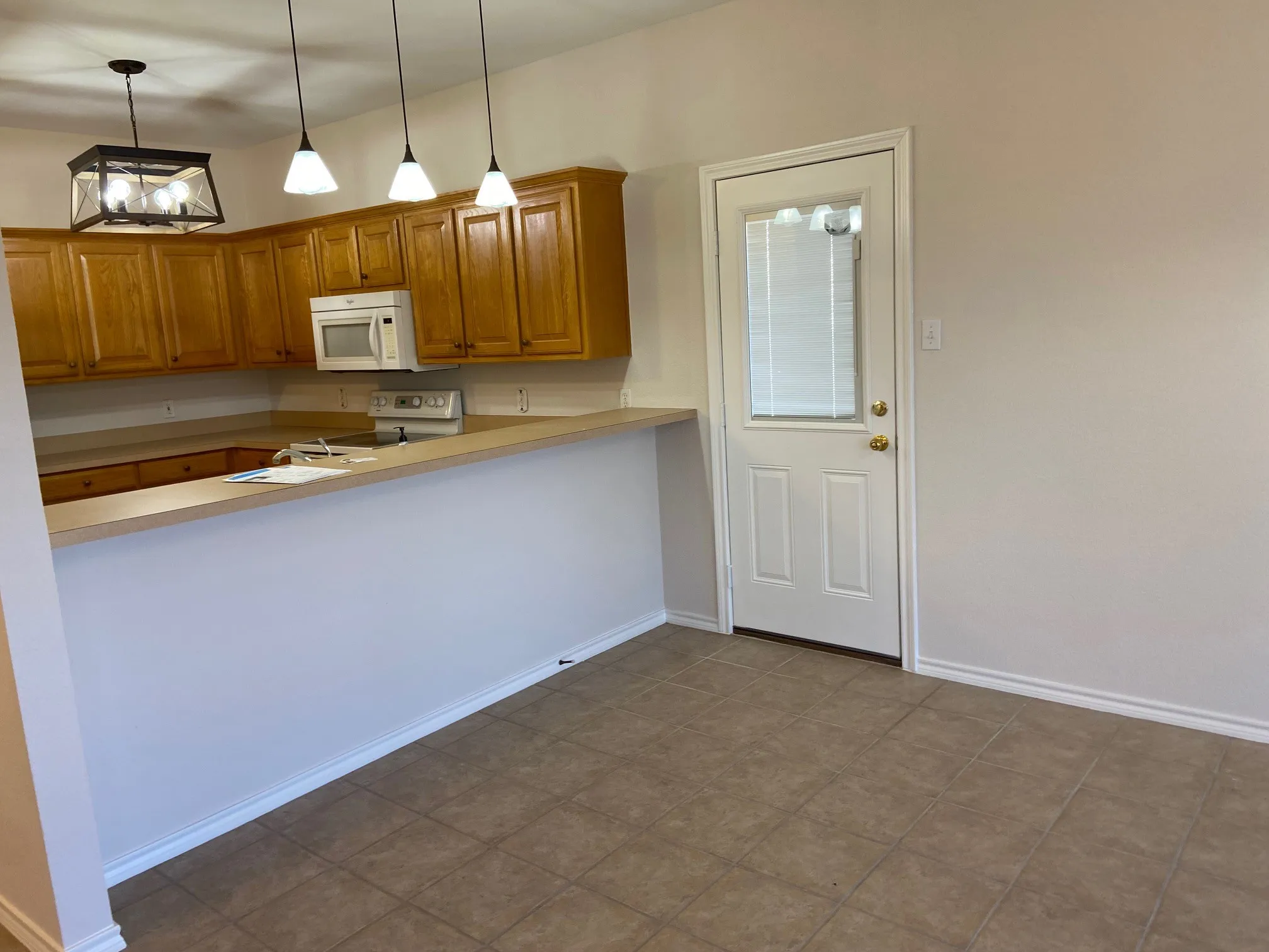 Kitchen bar area blending into dining area.