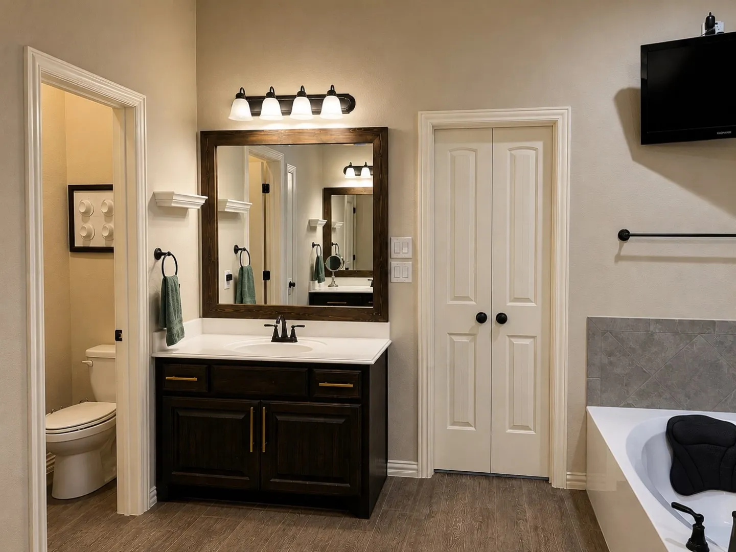 Dark wood-finish vanity with white countertop, framed mirror, and matte black fixtures