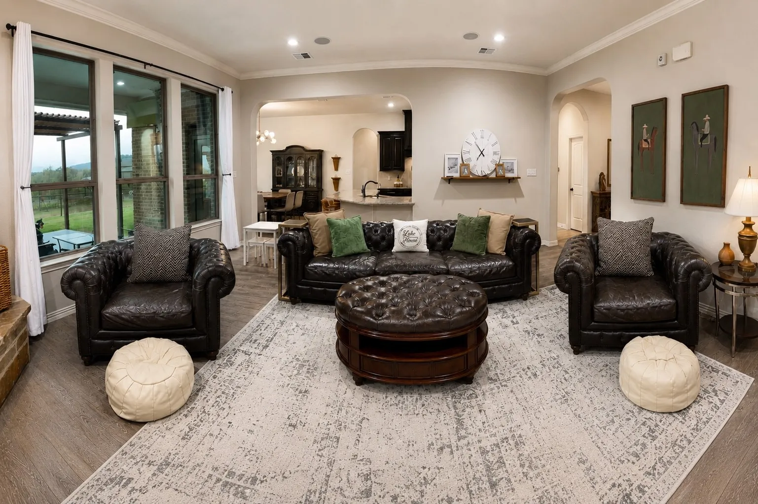 Expansive living space featuring wood-finish flooring, recessed lighting, and large​​‌​​​​‌​​‌‌​‌‌​​​‌‌​‌​‌​‌​​​‌​​ windows