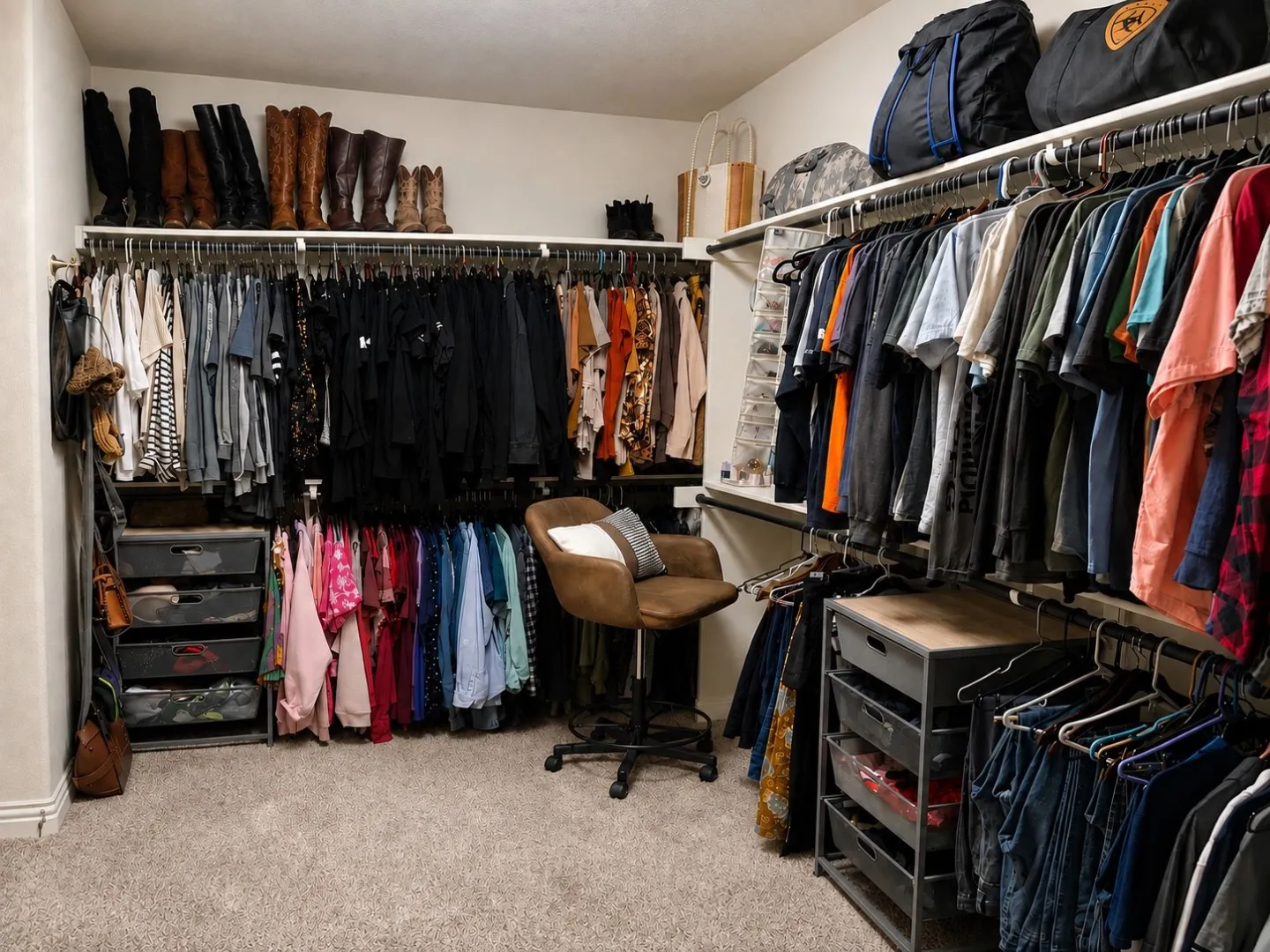 Built-in closet system featuring multiple hanging rods, integrated shelving, and carpet flooring