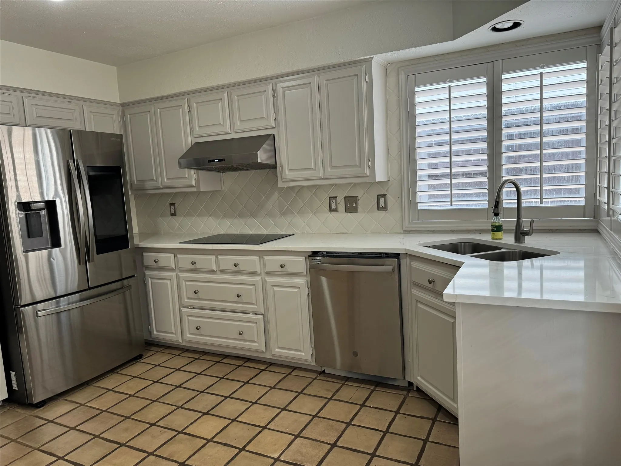 kitchen has stainless steel appliances