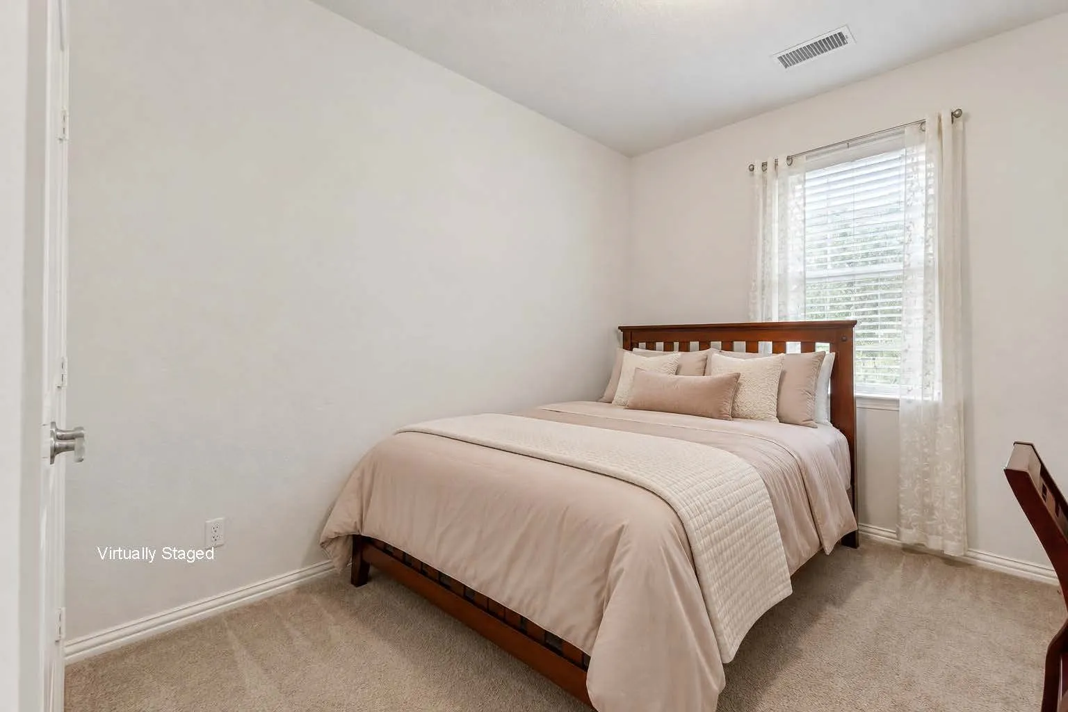 Virtually Staged- This third bedroom is currently used for a guest room and office.
