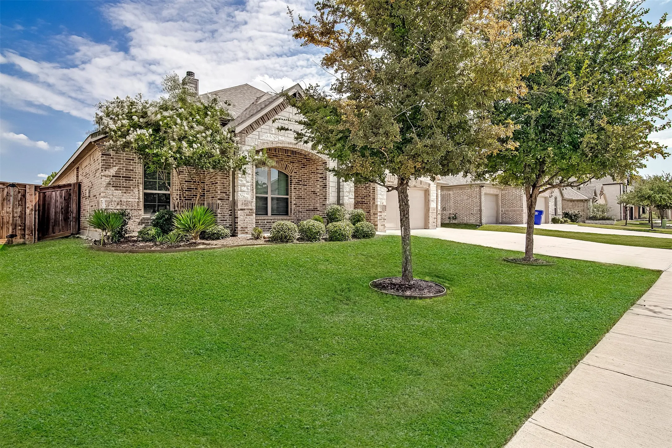 Brick and stone exterior with arched entry