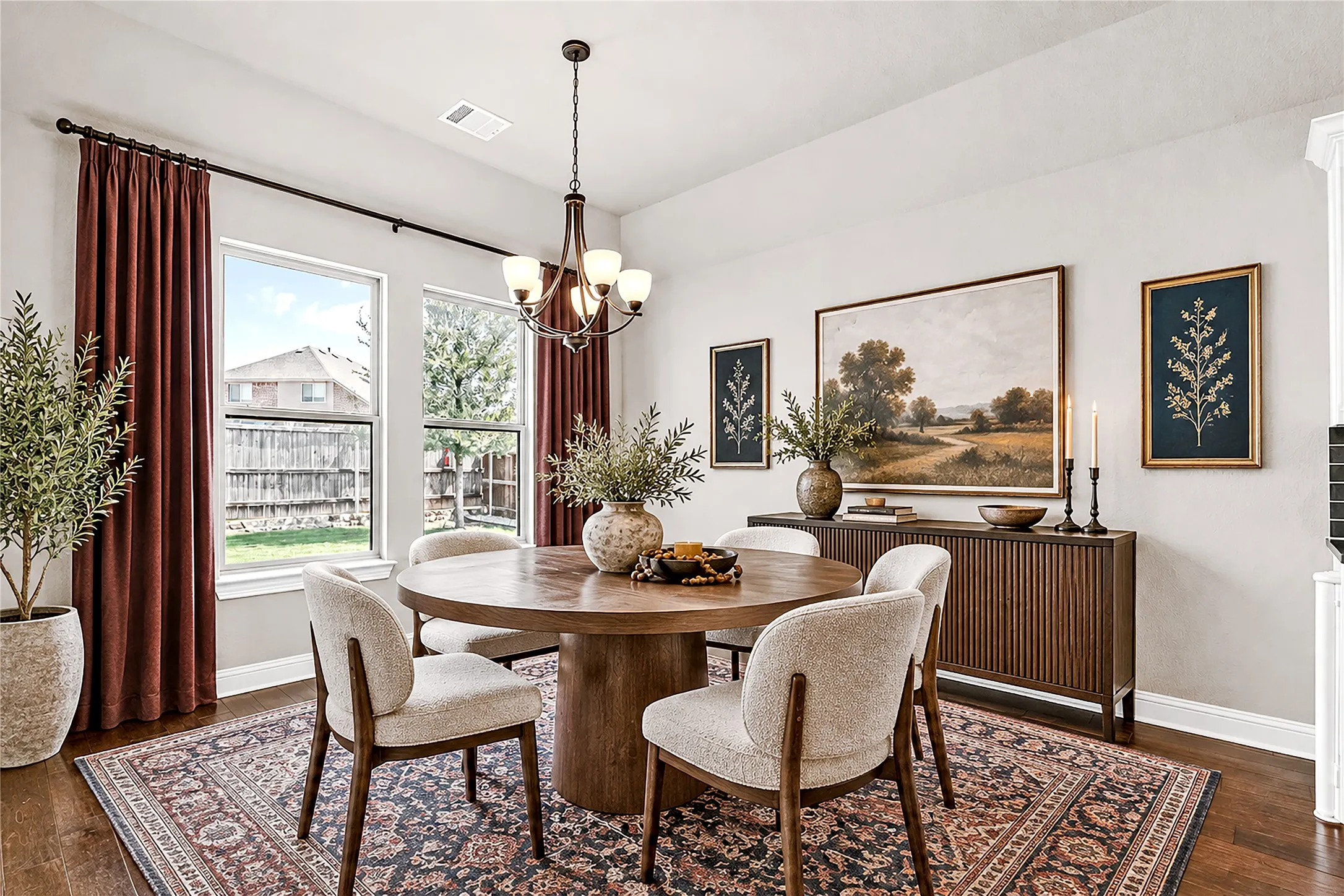 Hardwood-finish flooring, a contemporary chandelier, multiple windows, and a built-in wood-slat console table. Virtual staged.