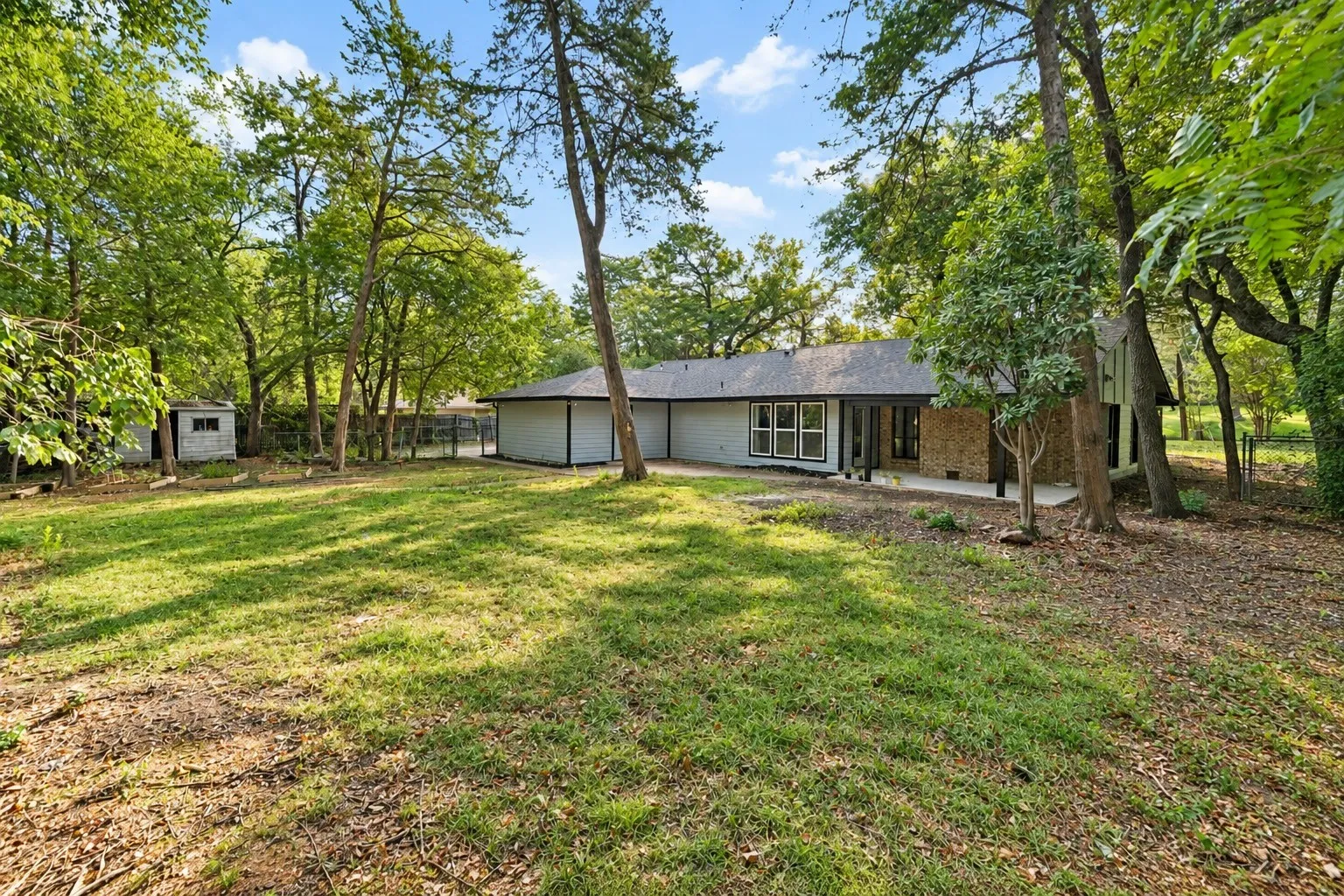 Very large backyard with beautiful mature trees
