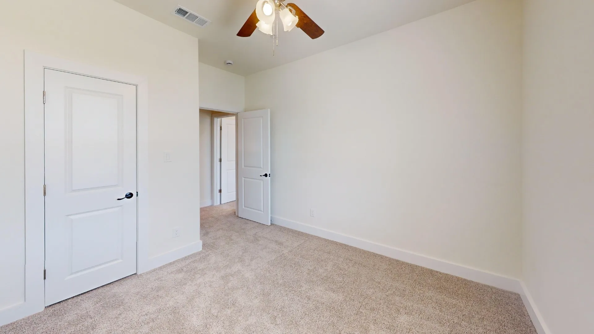 Neutral-toned carpeting with white trim