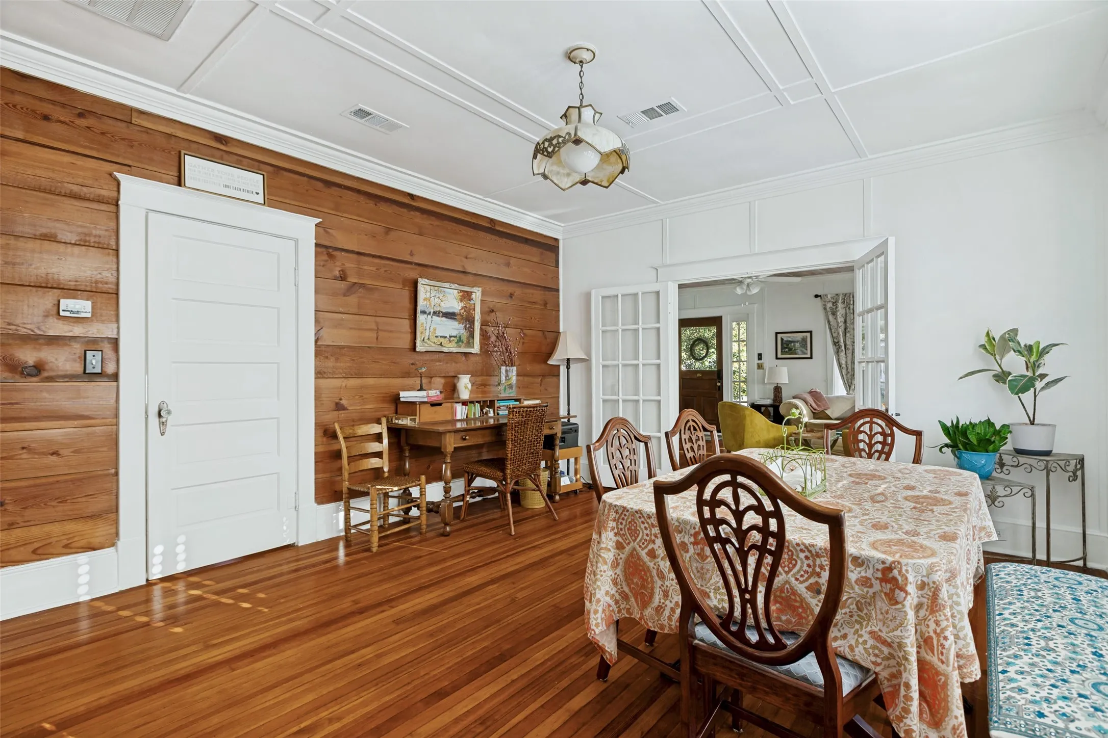 Wood-finish flooring with a horizontal wood-paneled accent wall