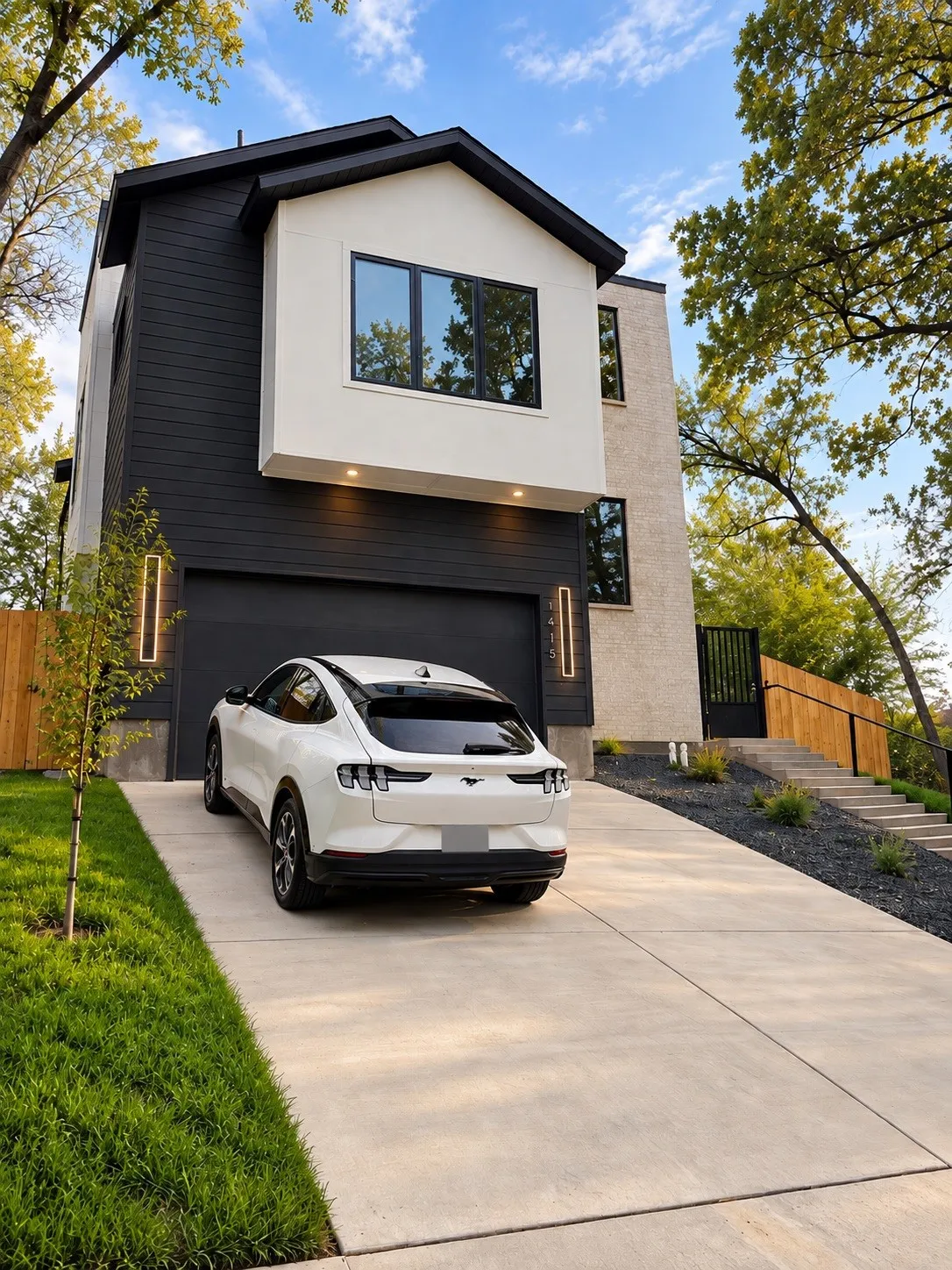 Modern exterior featuring a prominent gabled roofline and contrasting black and white siding