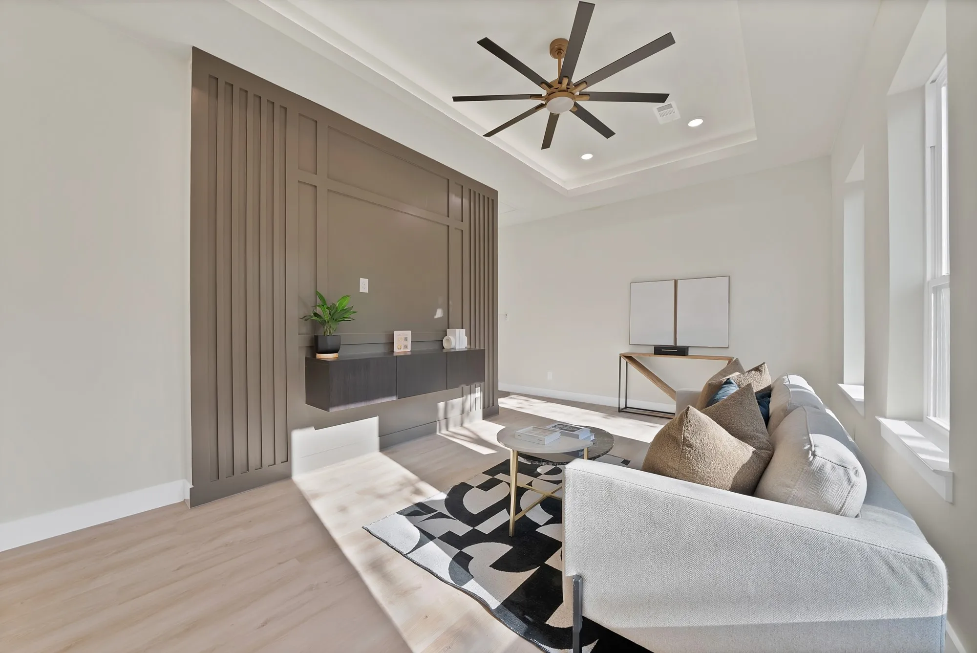Tray ceiling with recessed lighting and modern ceiling fan